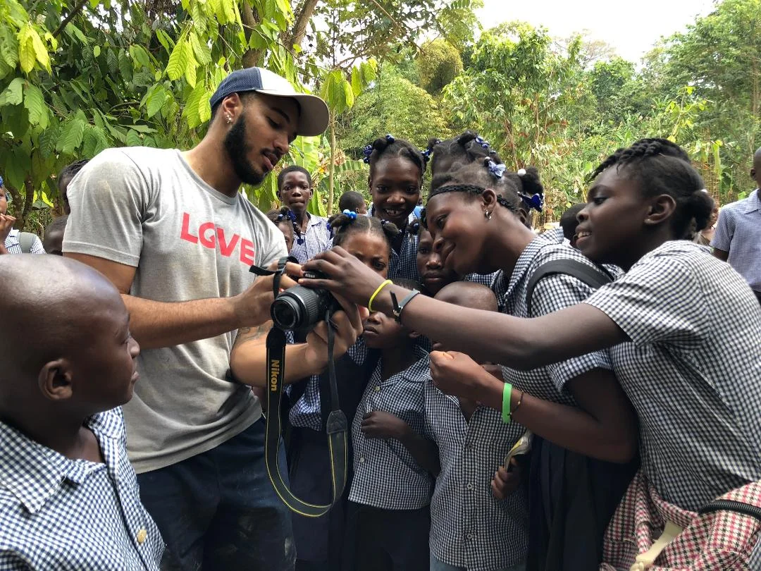 Louis hanging with school kids in pichon.