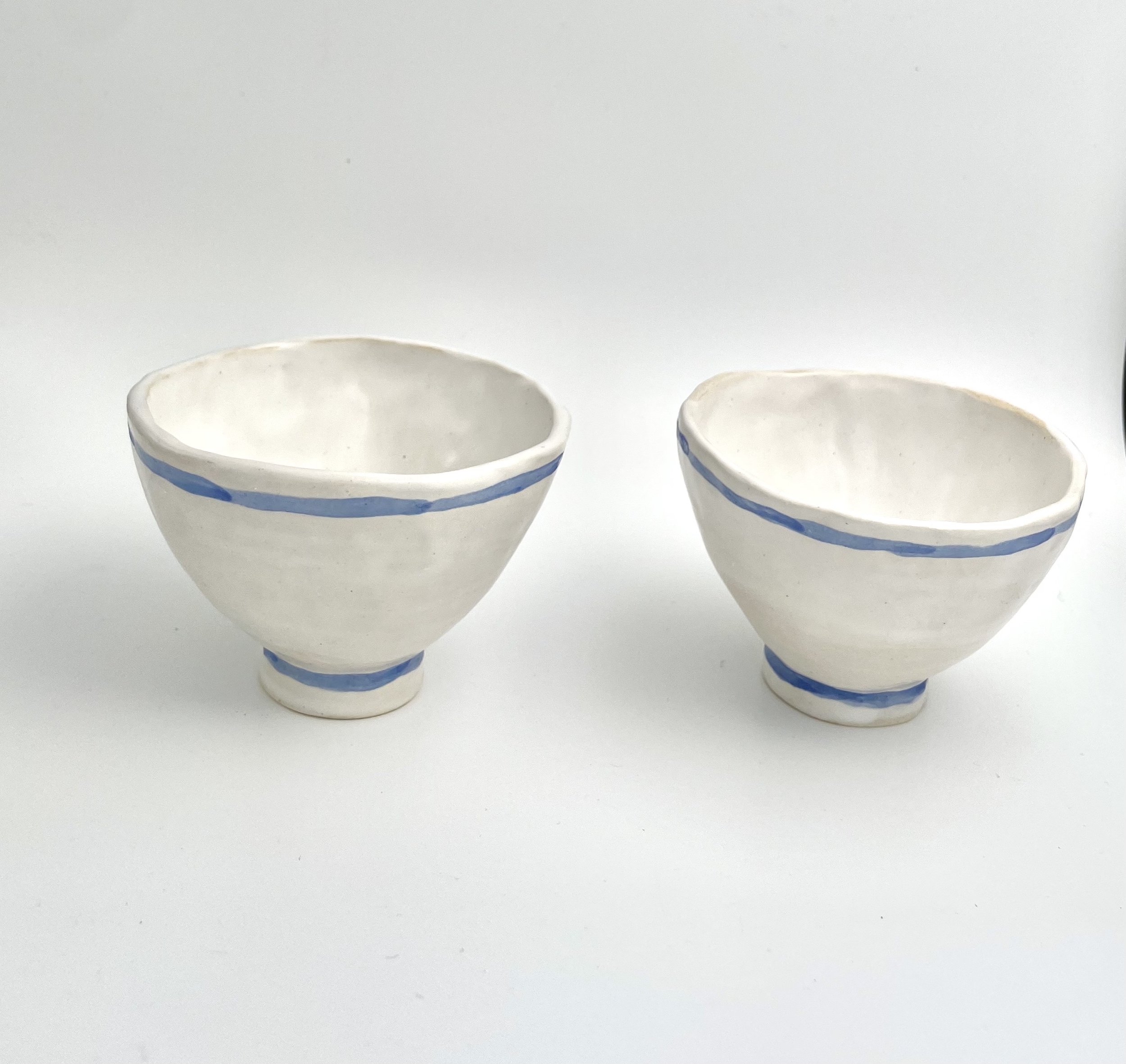 two small white and blue bowls with foot.jpg