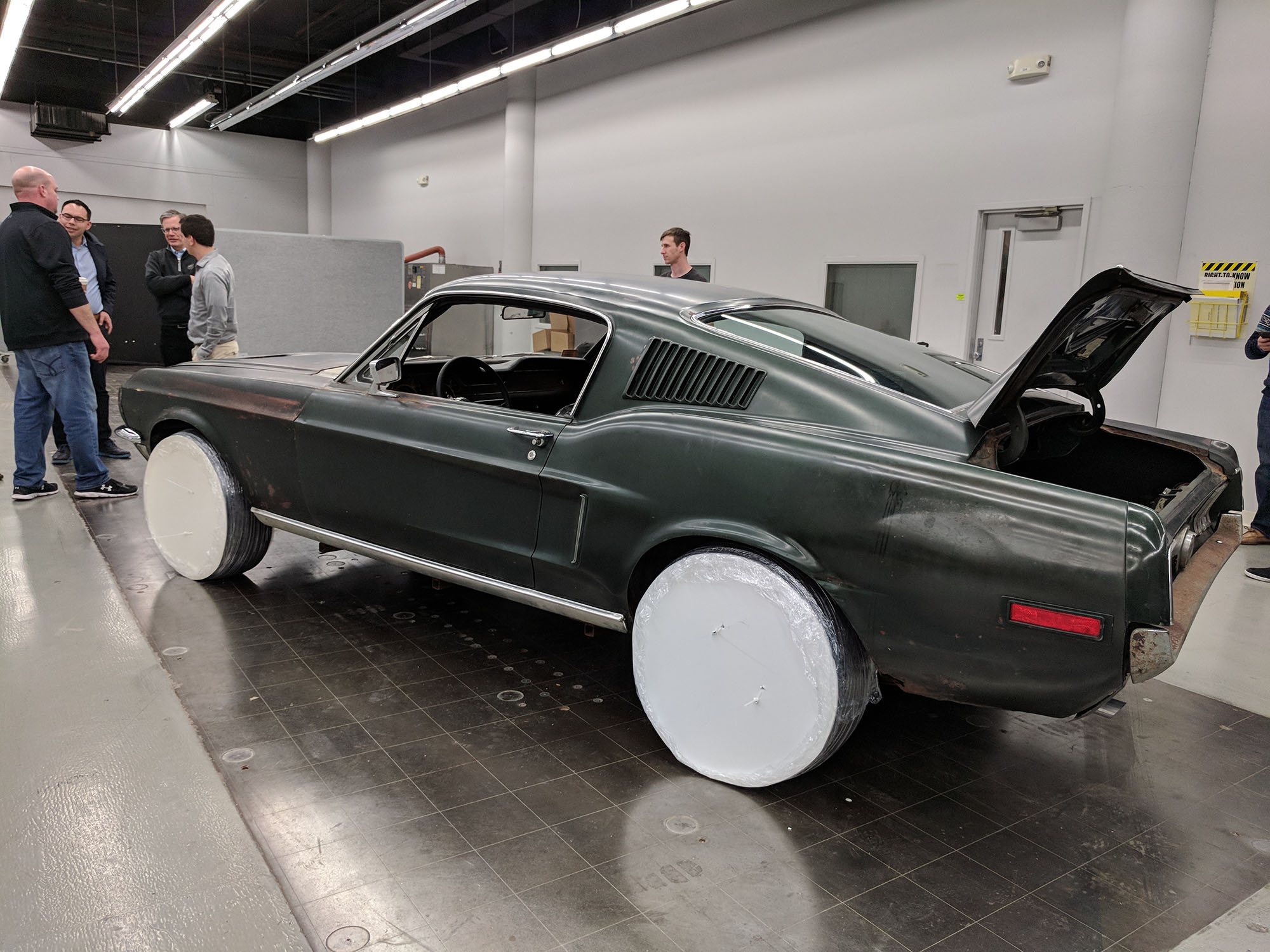   After the film crew taped my reaction to seeing the car, the owner started camouflaging it for transportation to the Cobo Center.  Property Brad Bowling   