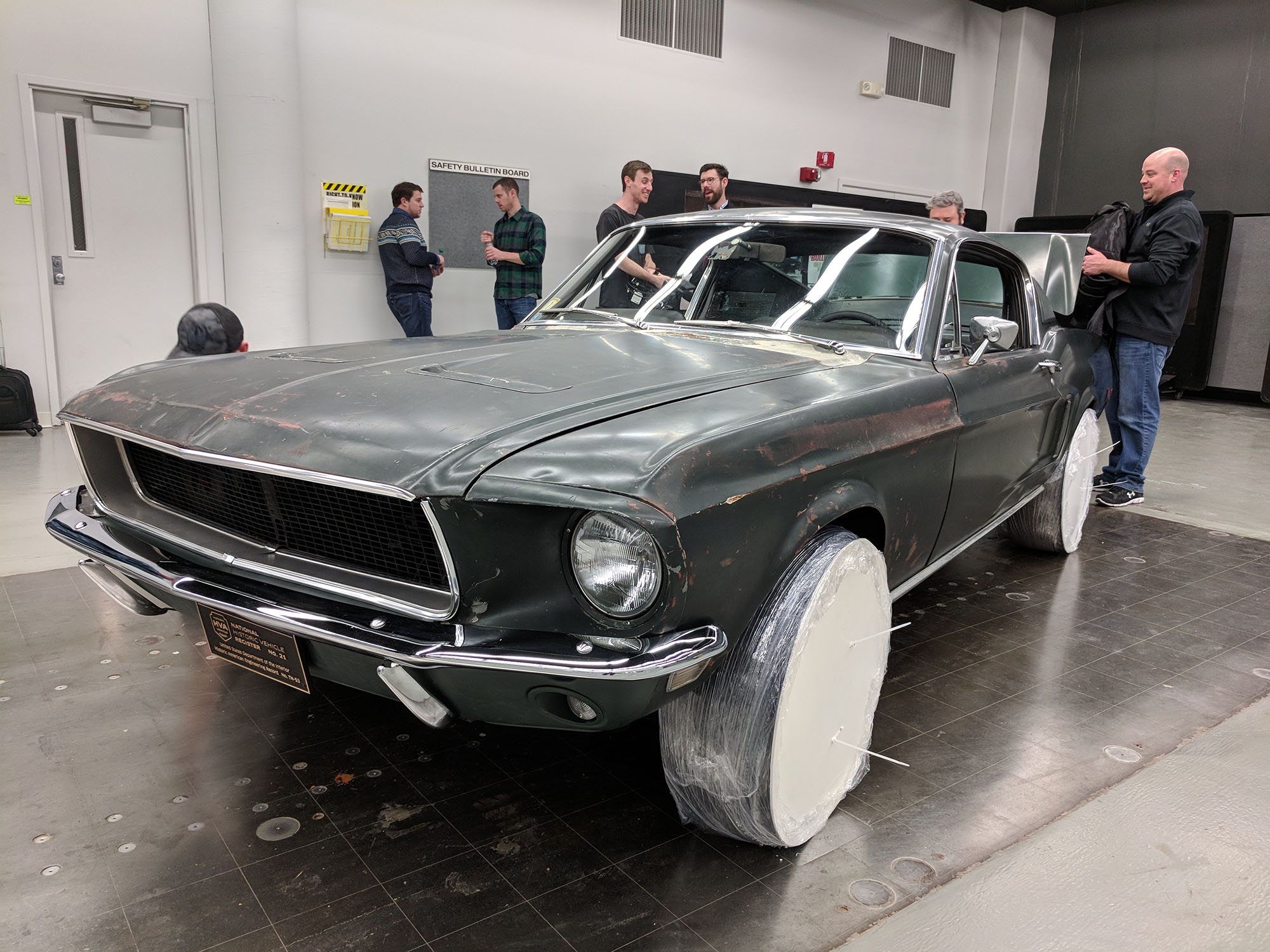   After the film crew taped my reaction to seeing the car, the owner started camouflaging it for transportation to the Cobo Center.  Property Brad Bowling   