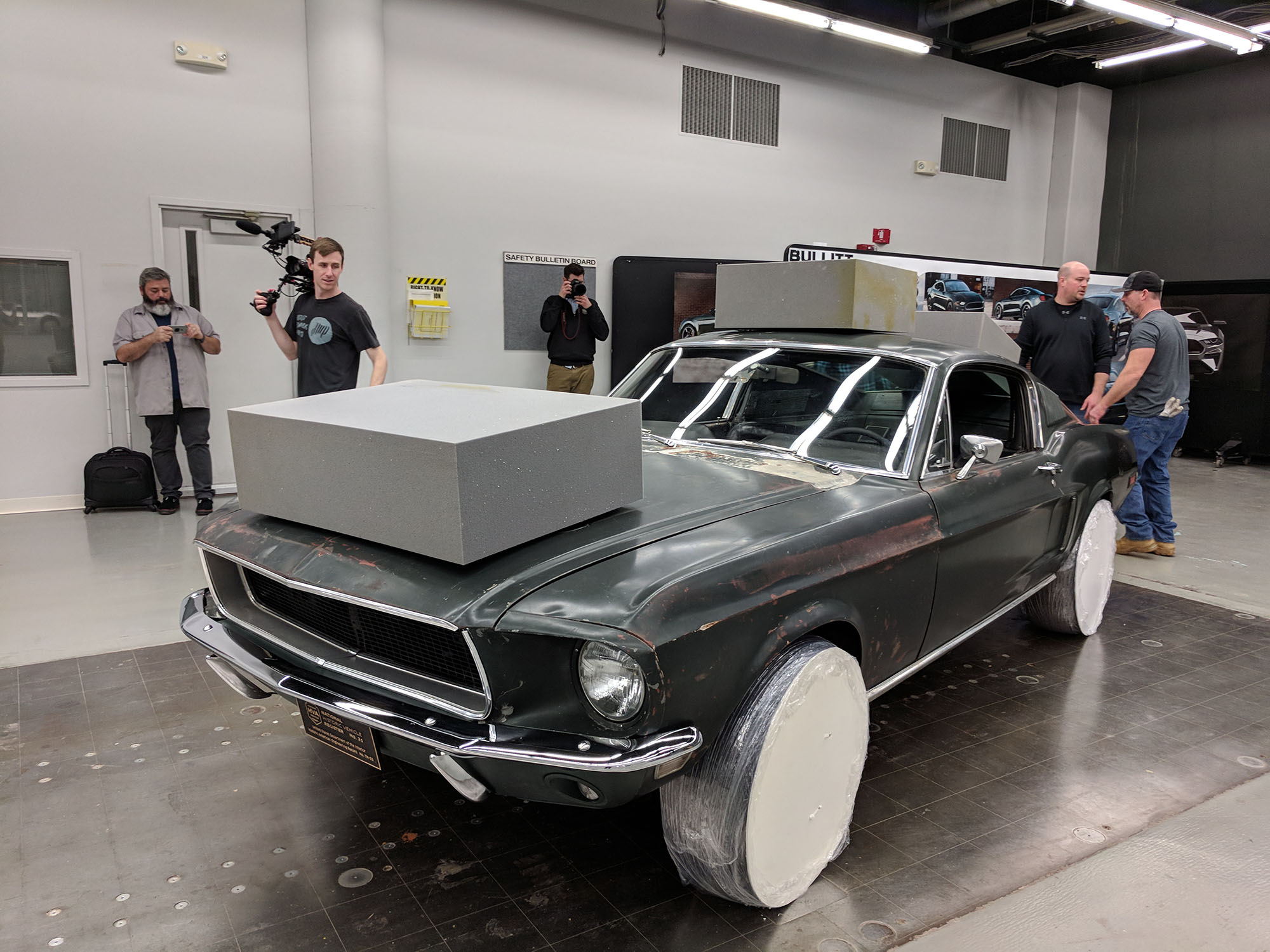   After the film crew taped my reaction to seeing the car, the owner started camouflaging it for transportation to the Cobo Center.  Property Brad Bowling   