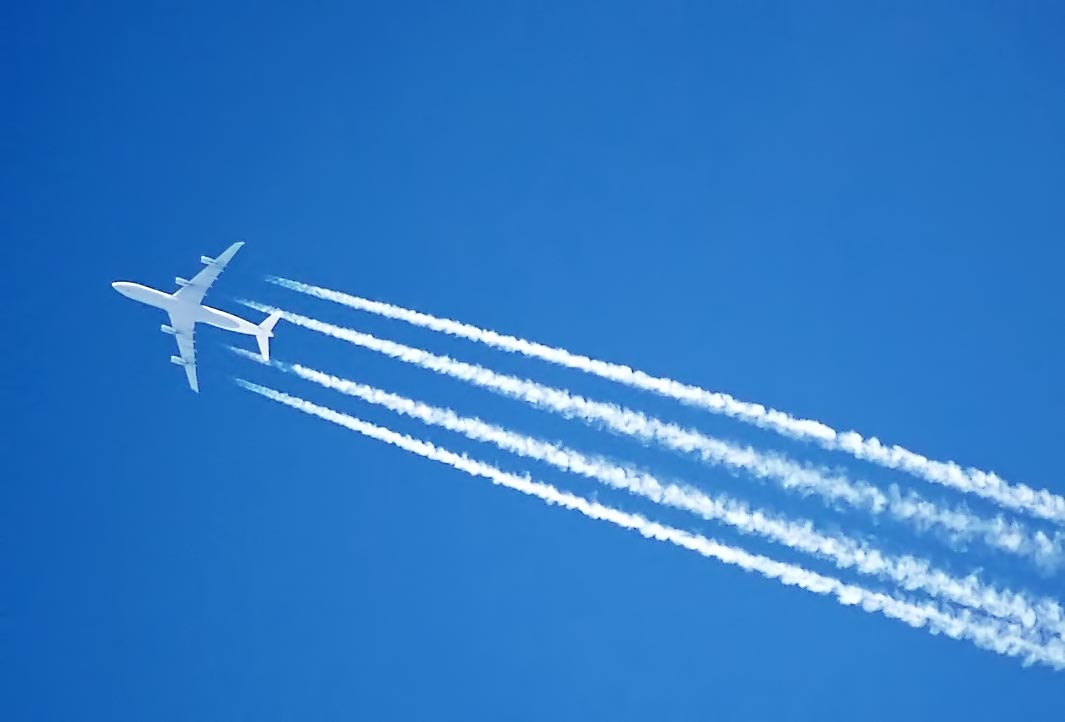 A photo of a plane emitting mind controlling chemicals. Or are they weather controlling? Either way, we can all agree they're nefarious.