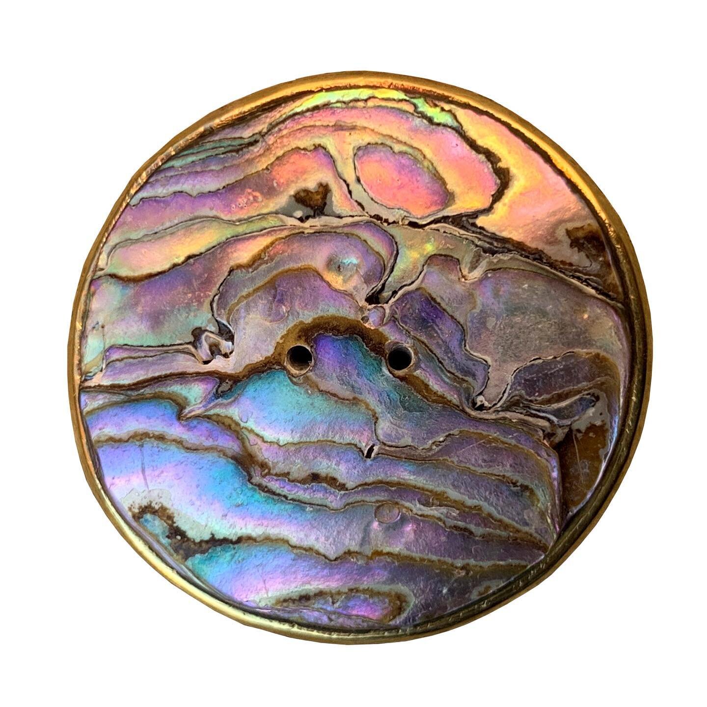 Big abalone and brass button. Reminds me of a sunset over the ocean.