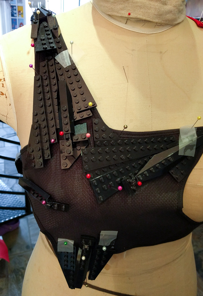 hand attaching LEGO® to black star