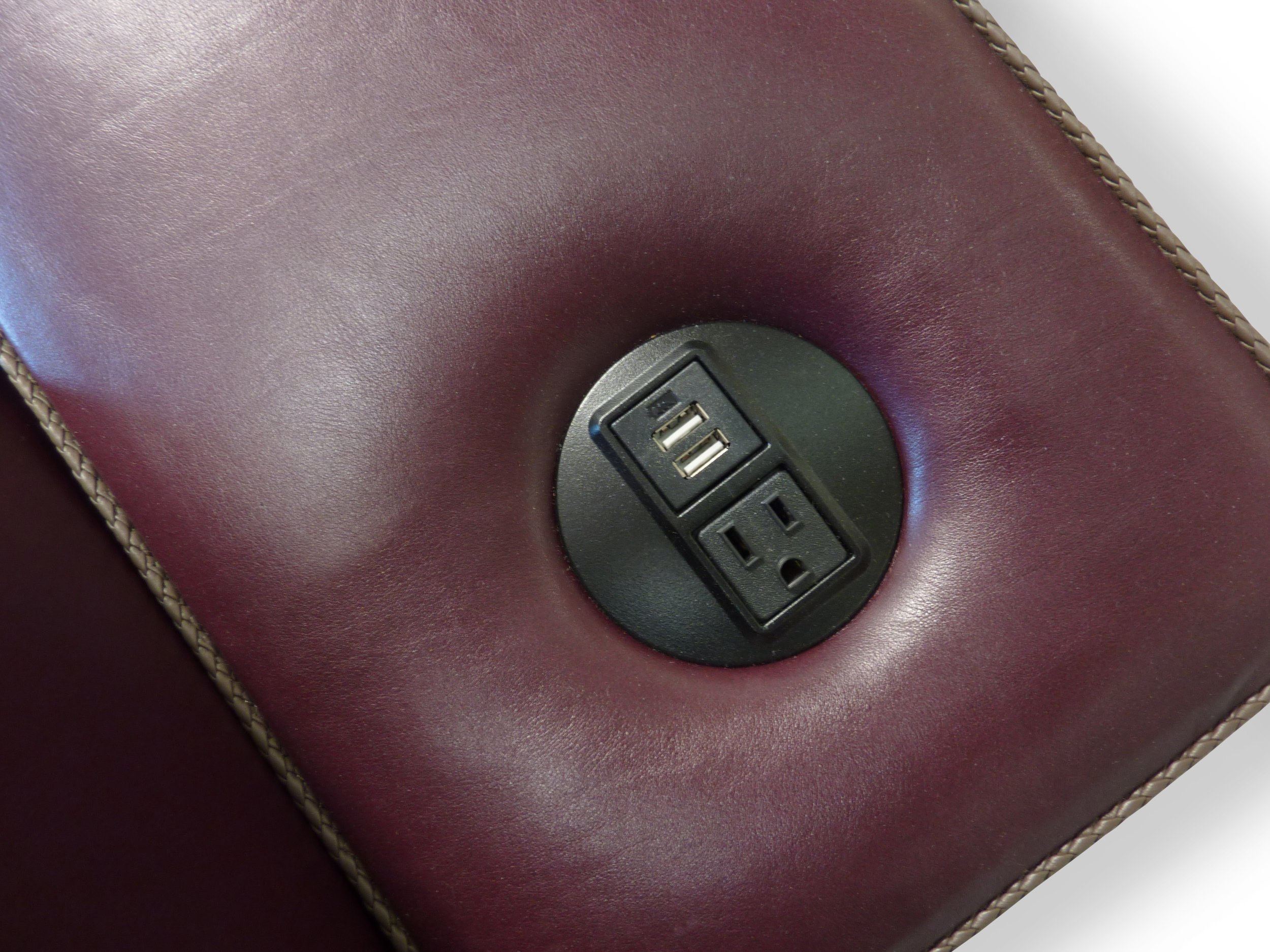 Electrical outlet and USB port in arm