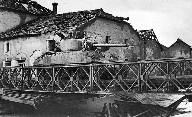 You may recall this from my previous entry. This is a Sherman from the 761st tank battalion, crossing a bridge.