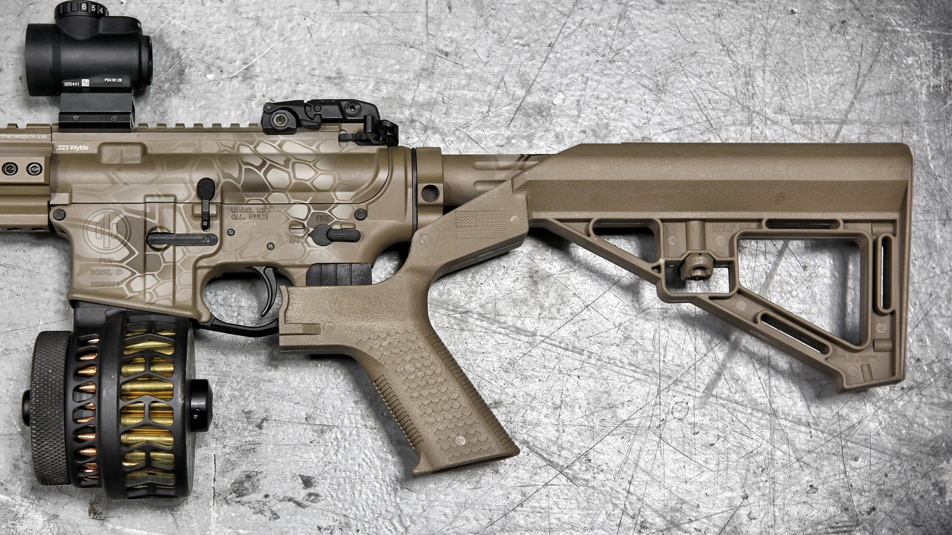 Well, the color's nice, but drum mags and that stupid goddamn bump-fire stock have ruined it. Also, about that magazine, wouldn't a cheaper way to jam your AR-15 just be to smear dirt on the rounds before you put them in the magazine?