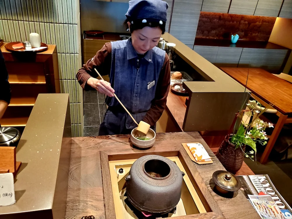 Tea master preparing matcha at Ippodo Tea Store in Ginza, Tokyo.