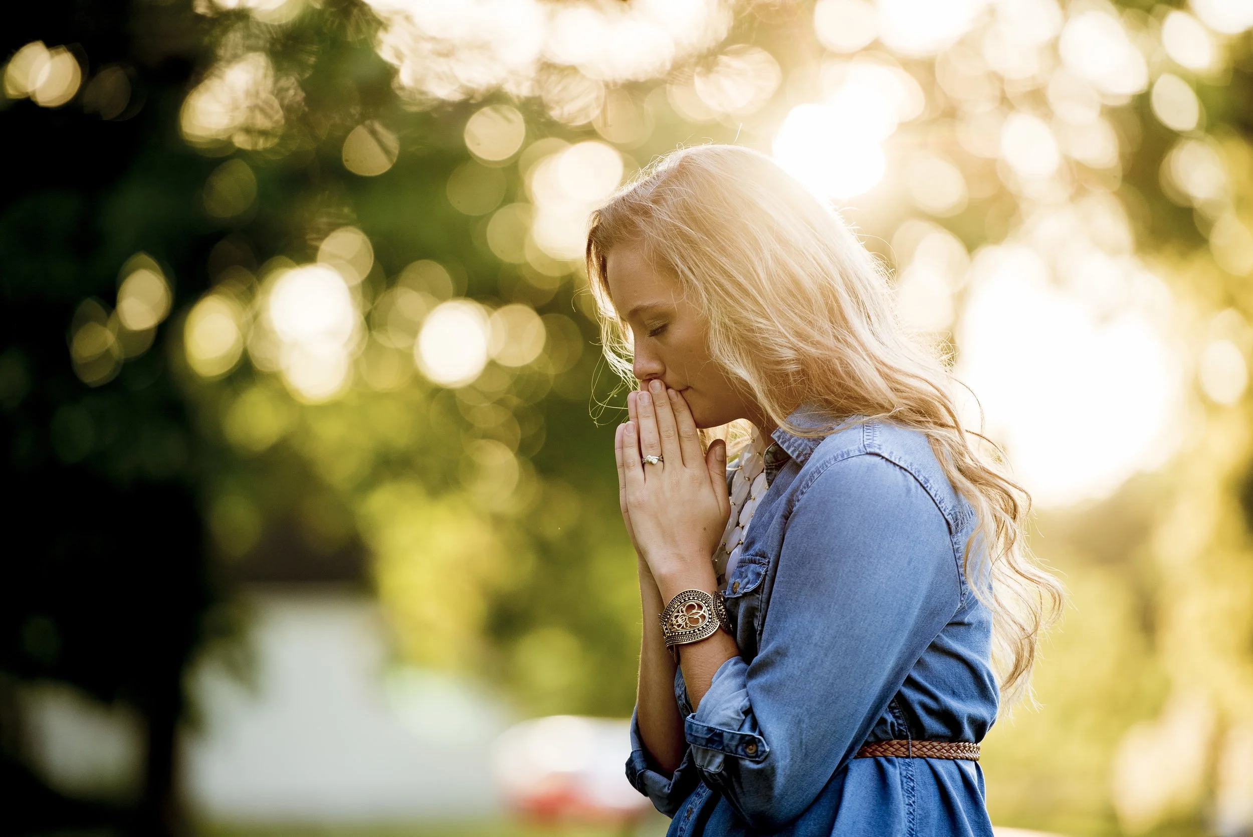 shallow-focus-shot-female-praying.jpg