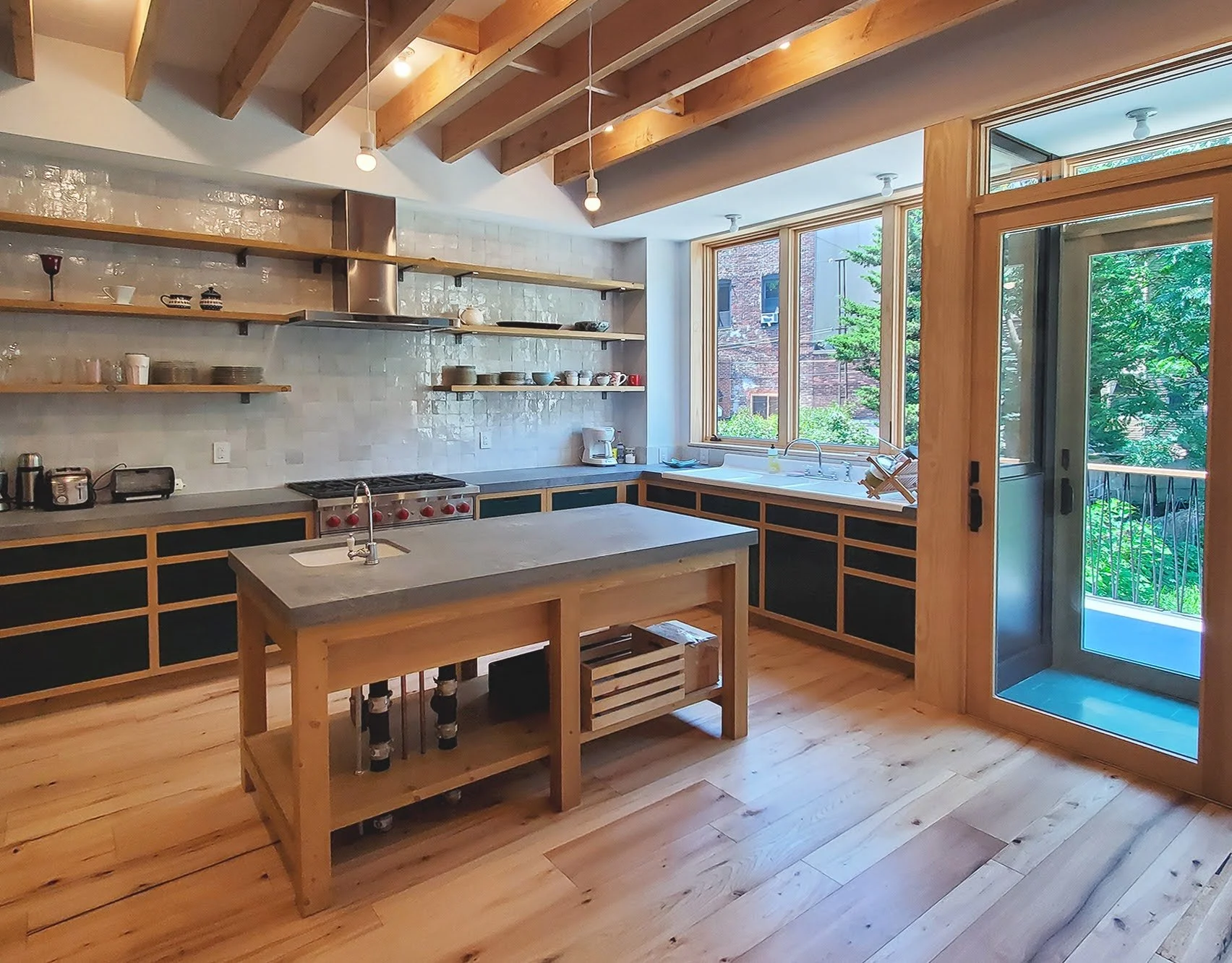 The backsplash consists of handmade terracotta tiles, known as Zellige tiles.