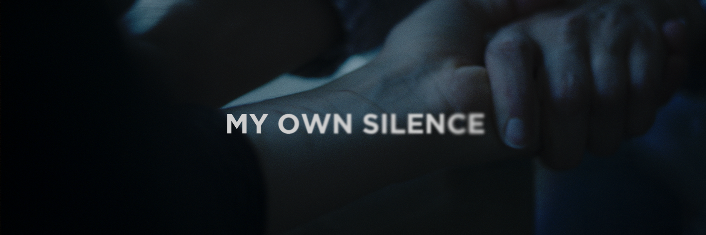 A close-up of two hands clasped together with the text 'MY OWN SILENCE' overlaid on the image.