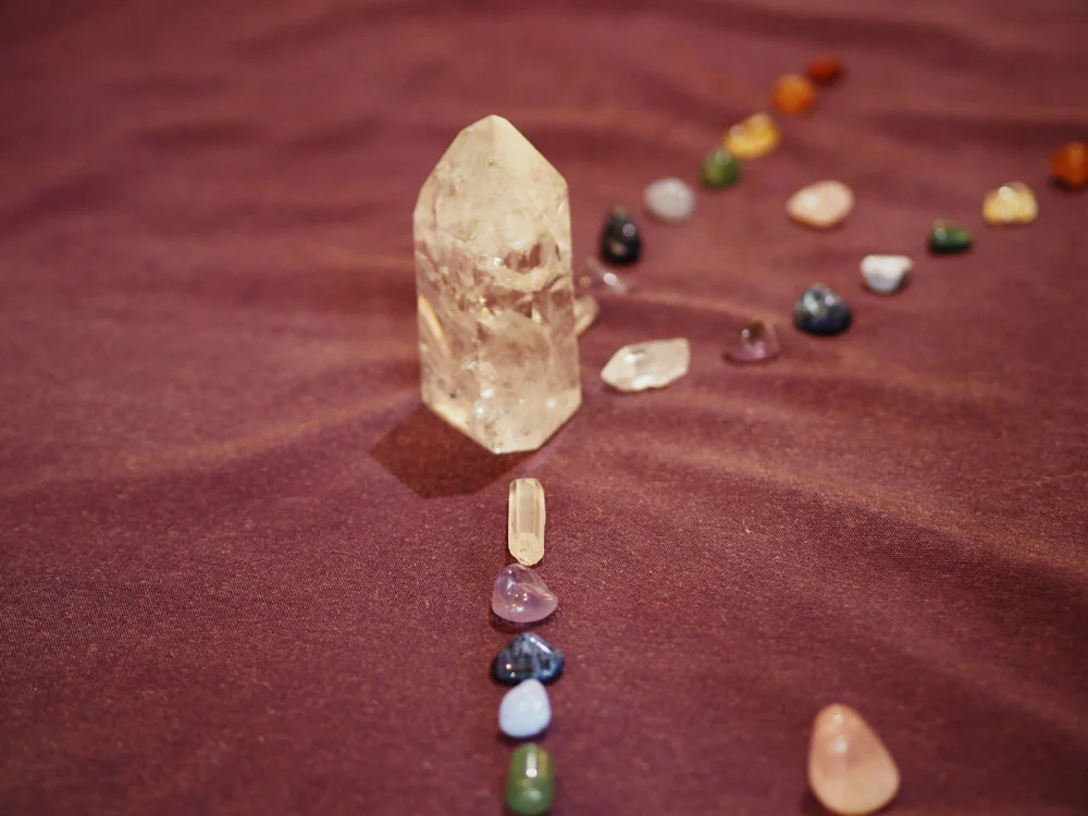 working with a variety of crystals to create a collective mandala during the crystal experience. 