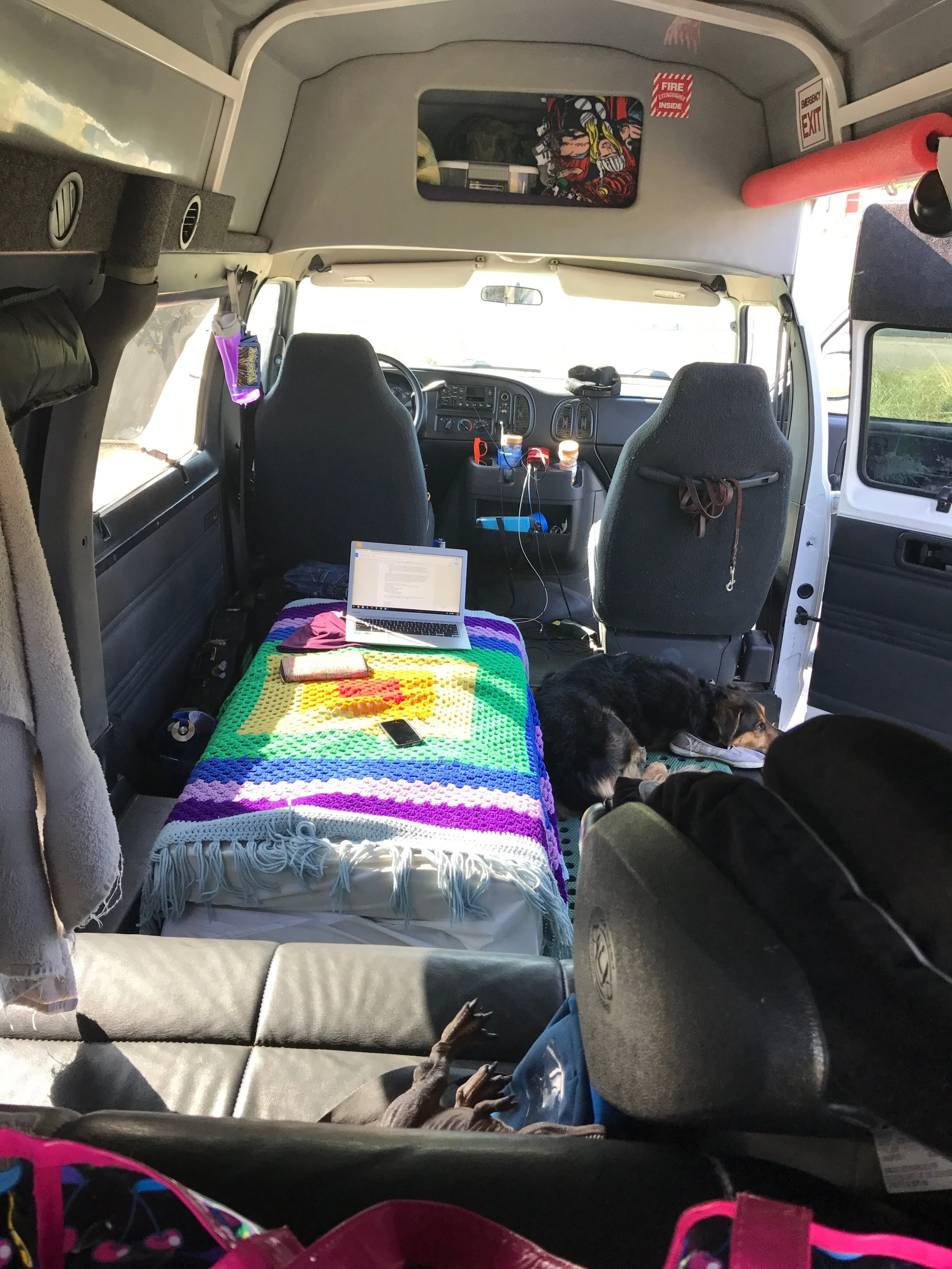 Bird’s eye view inside our van house. Our foldable bed is a couch during the day to save space.