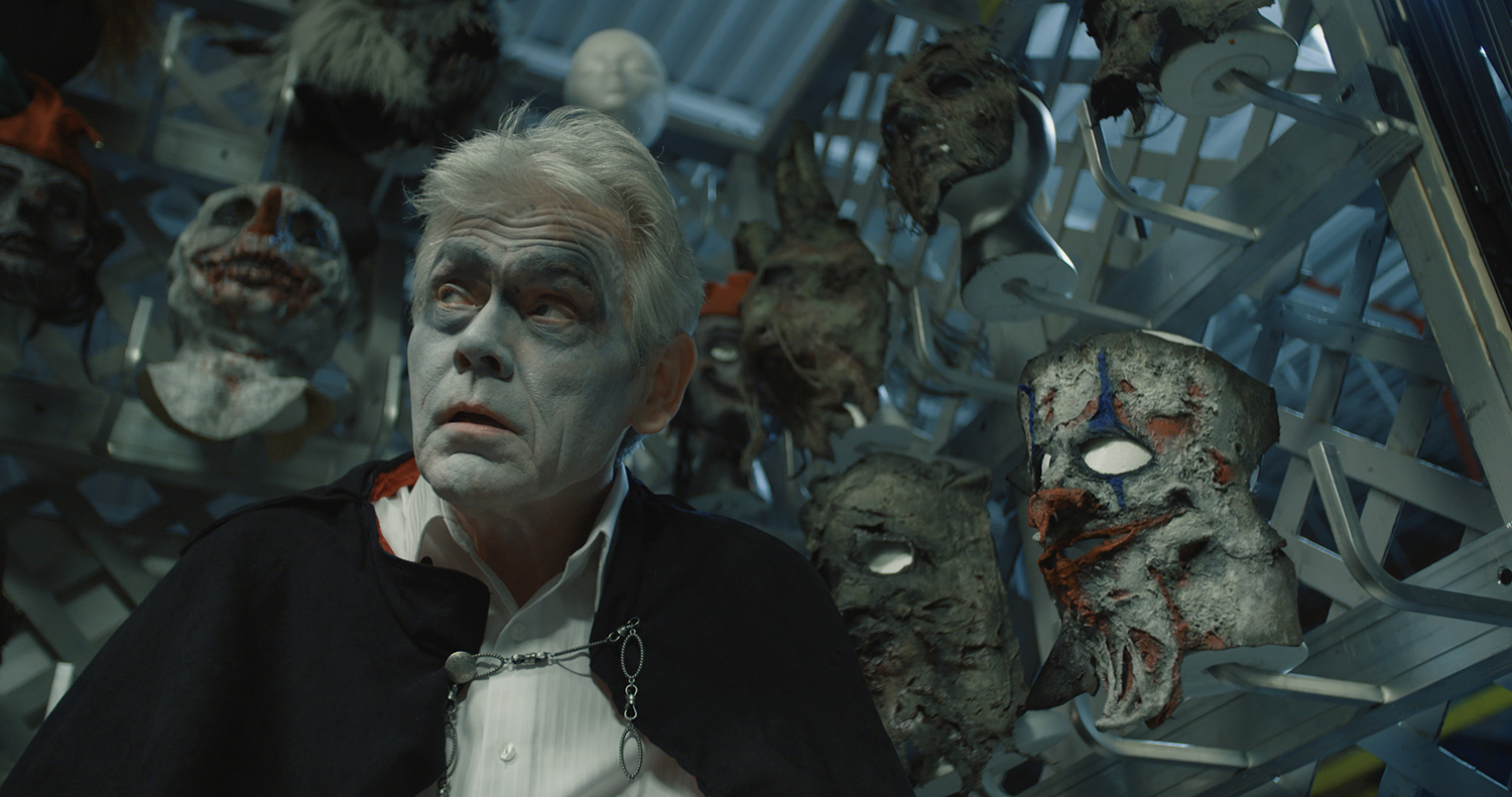 Often, we can't tell if John is wearing the costume, or if in fact the costume is wearing him . Behind are masks, which can be seen literally as they are, or as the many burdens that the Creep has to face, or possibly his demons.