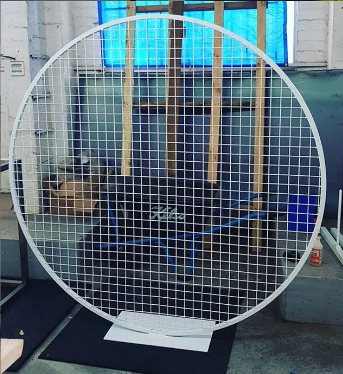 Round mesh framed backdrop display panel.