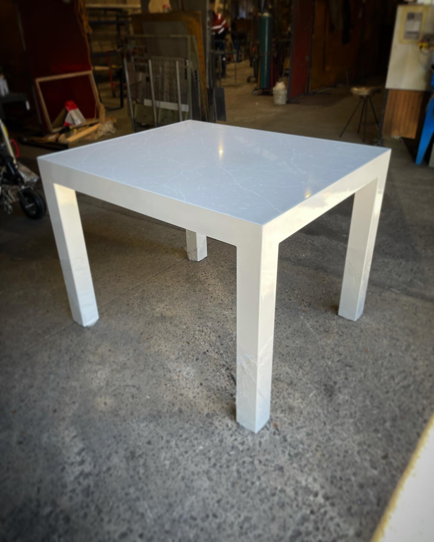 White marble with matching powder coated steel base.