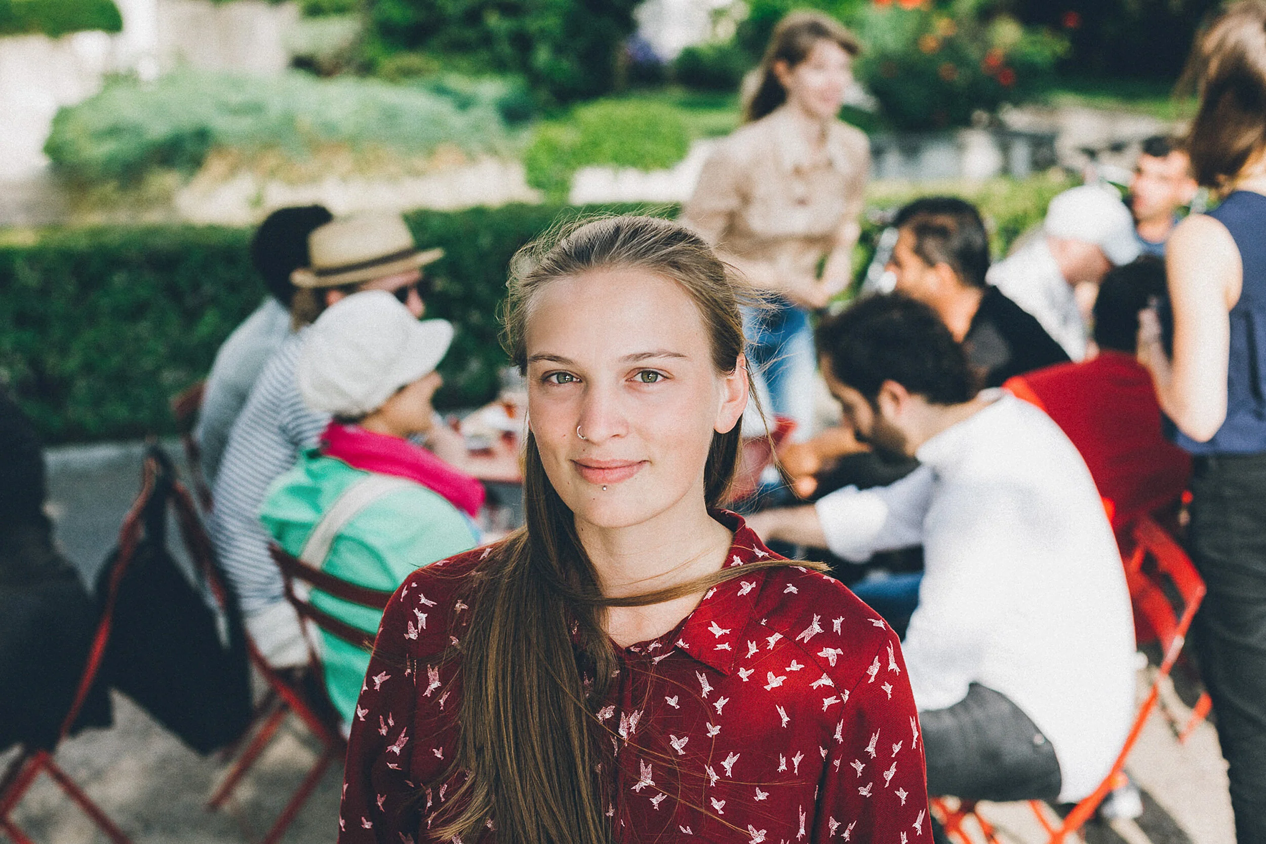 Outdoor portrait of a woman in red shirt
