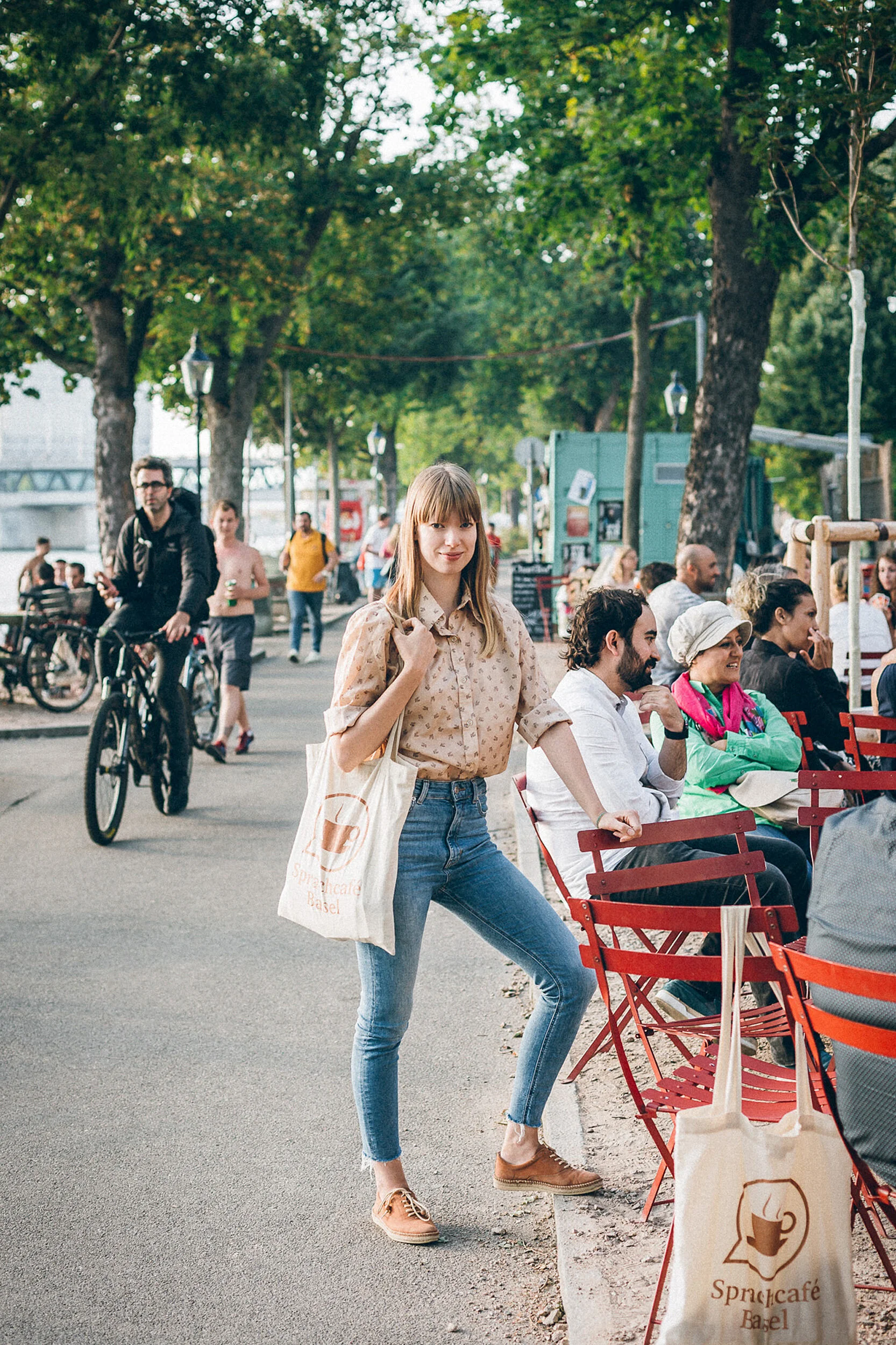Standing portrait of participant of Sprachcafé Basel next to Rhine