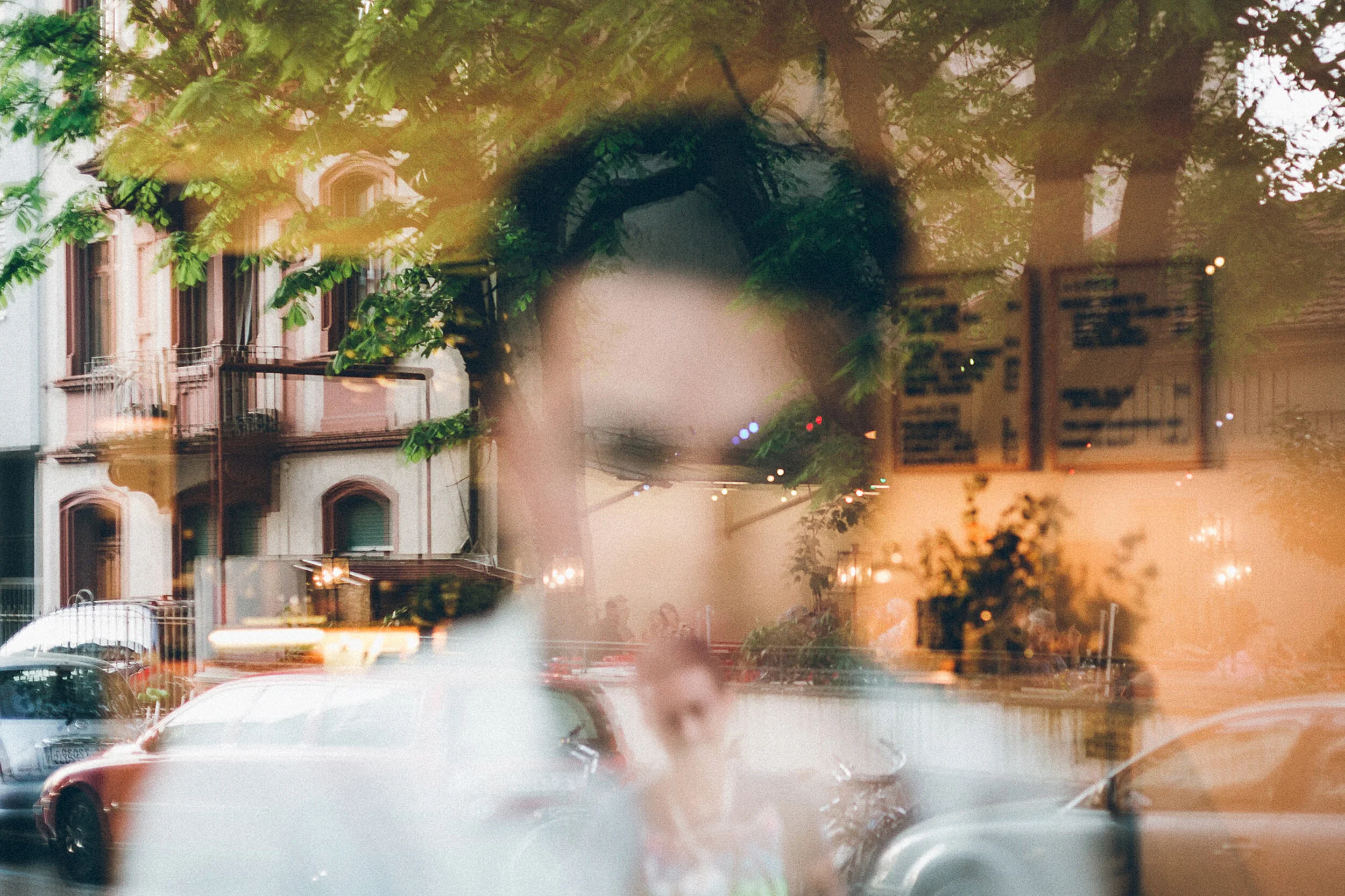 Blurred portrait of a man through a window