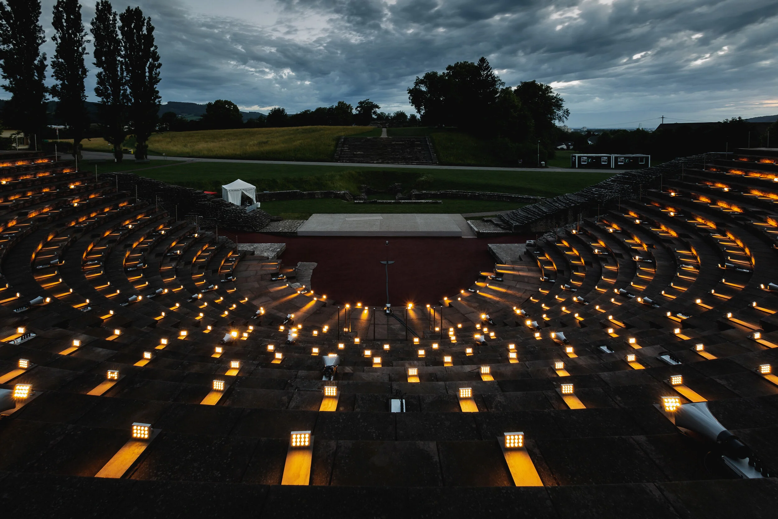 Sunset view of Augusta Raurica amphitheater with art installation by Lozano-Hemmer