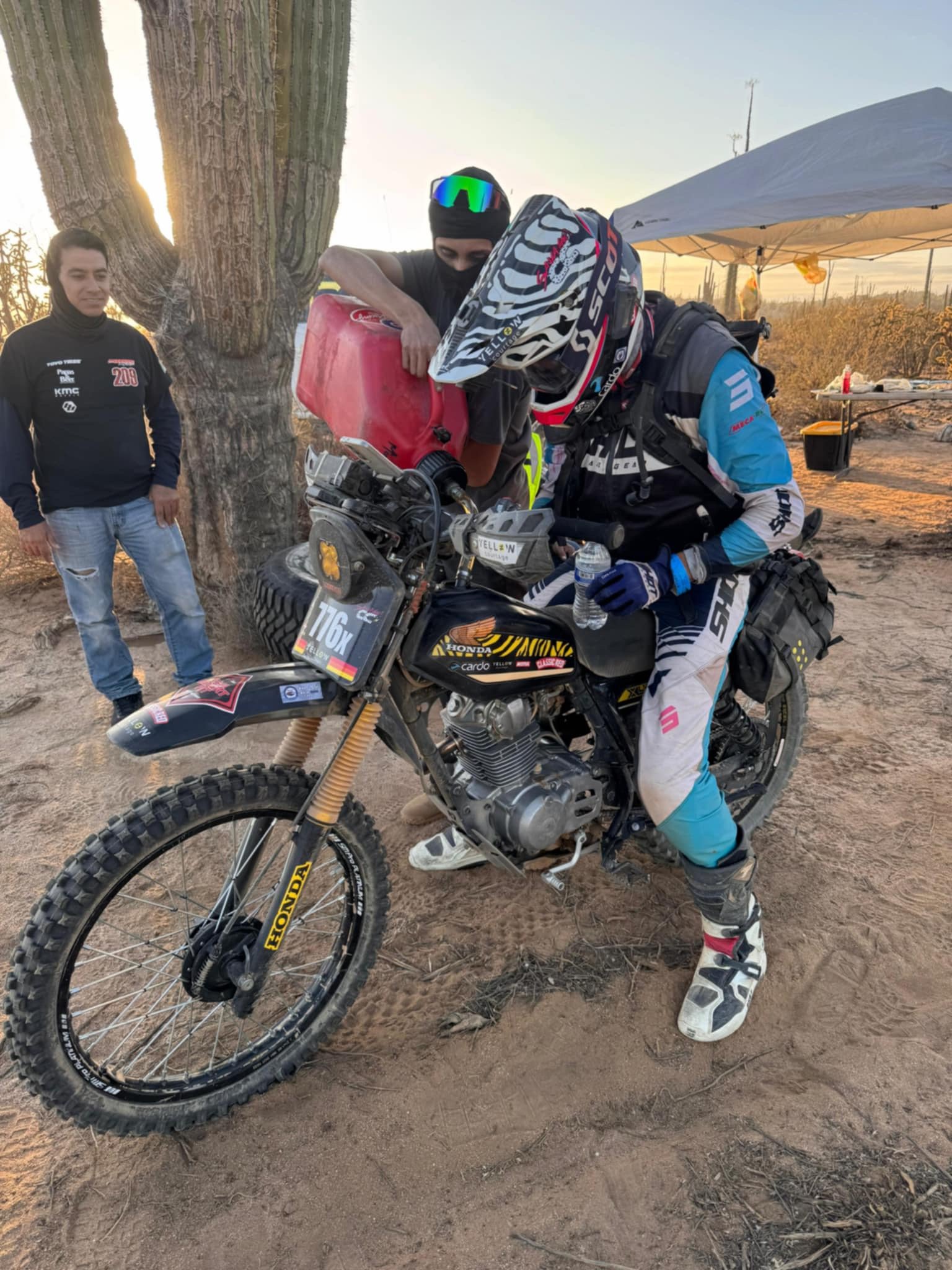Greg Gilson refuesl his 1980 Honda XL125S at the Baja 1000