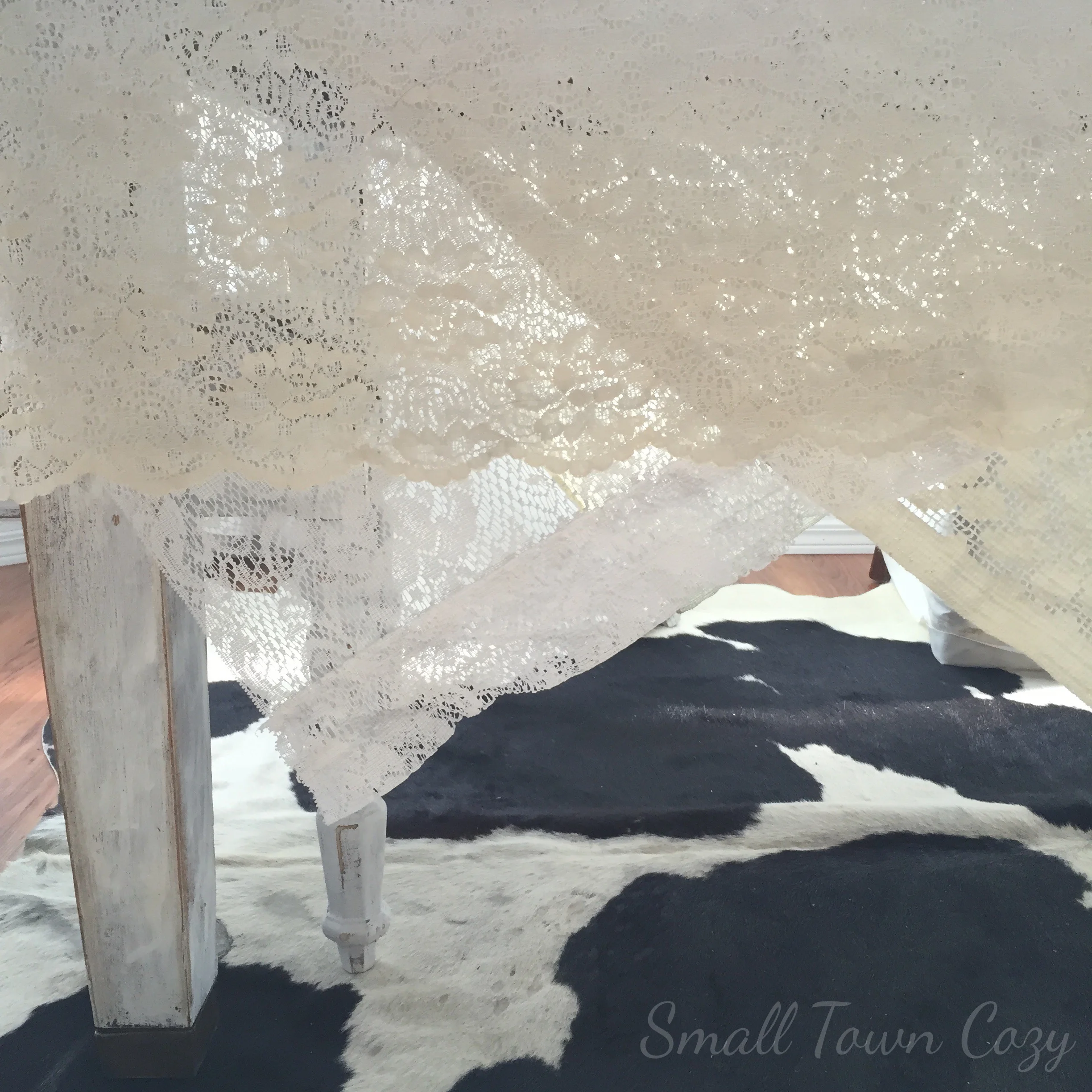 I layered four thrifted lace tablecloths. Two white and two ivory. I placed them all going different ways. I love how they look perfectly imperfect.