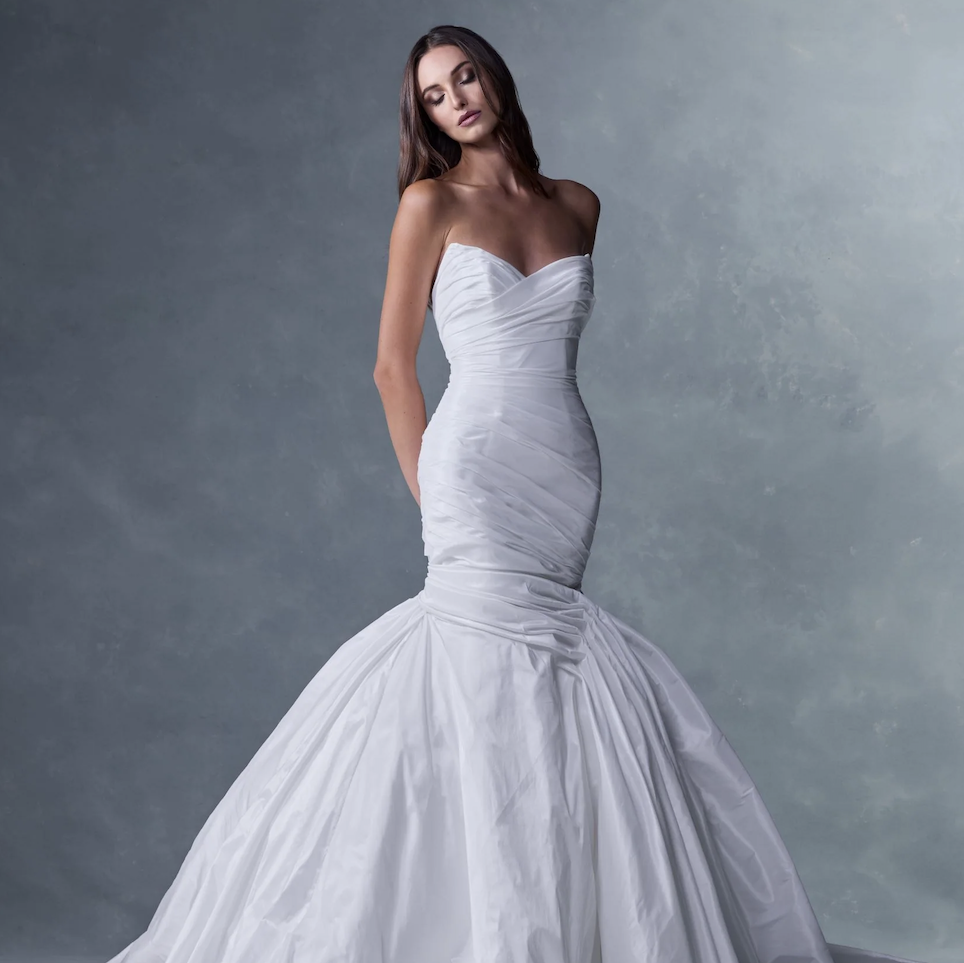 Valentina from the Ines Di Santo Heritage collection featuring a strapless sweetheart mermaid wedding dress with a softly draped bodice and dramatic full skirt.