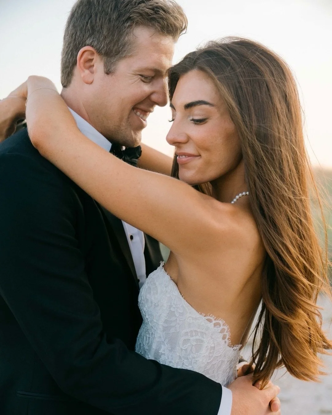 Ellie &amp; Trey on the shores of Hilton Head.

Ellie wore a breathtaking lace gown by Monique Lhuillier &mdash; romantic, refined, and effortlessly timeless against the coastal backdrop of their beautiful day.

For brides who love Monique as much as