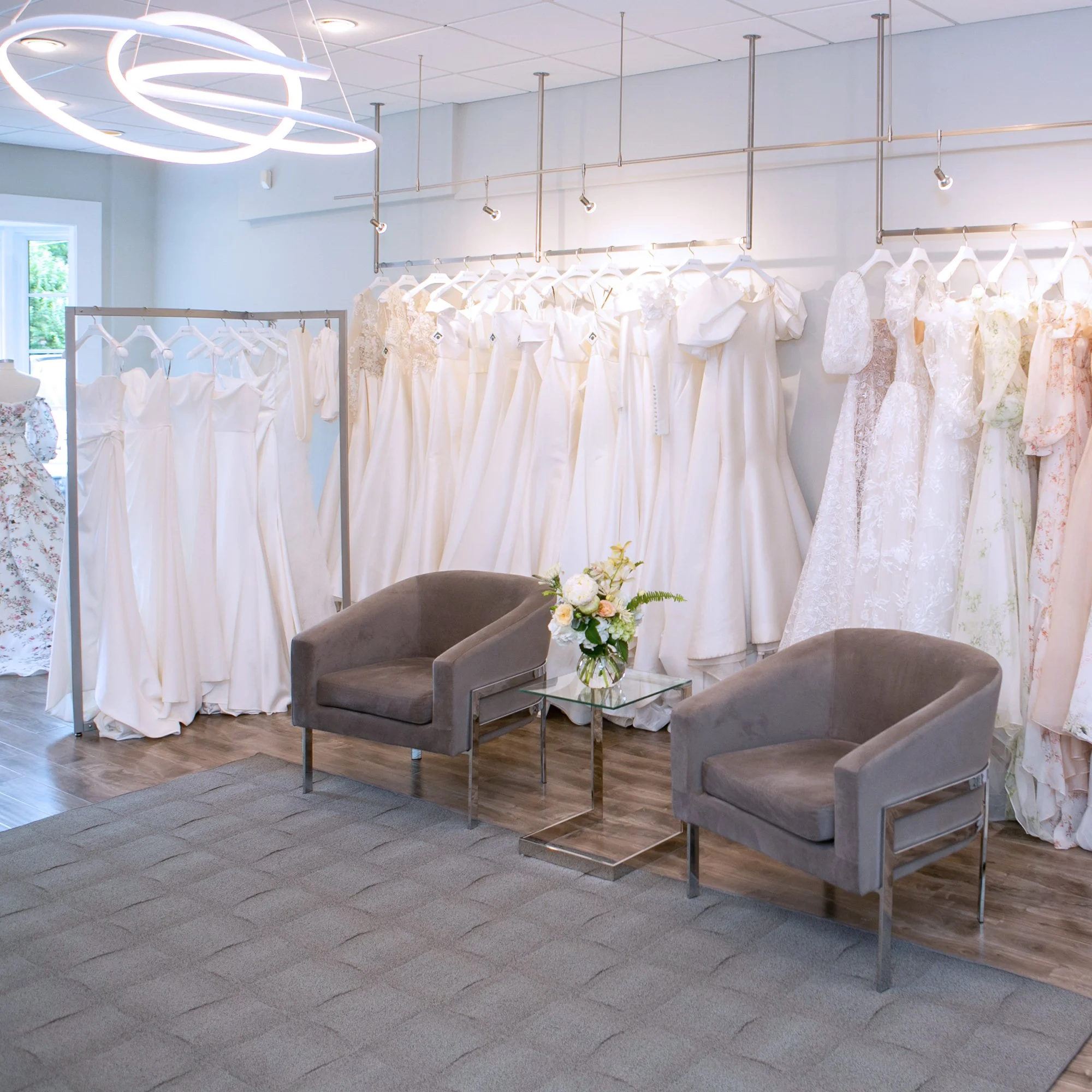 Interior of Alexia's Bridal Boutique in Charlotte featuring a curated collection of designer wedding gowns.