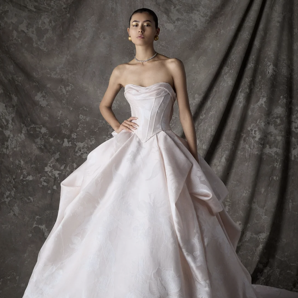 Albatha from the Ines Di Santo Couture collection featuring a sculptural strapless wedding gown with a modern architectural silhouette.