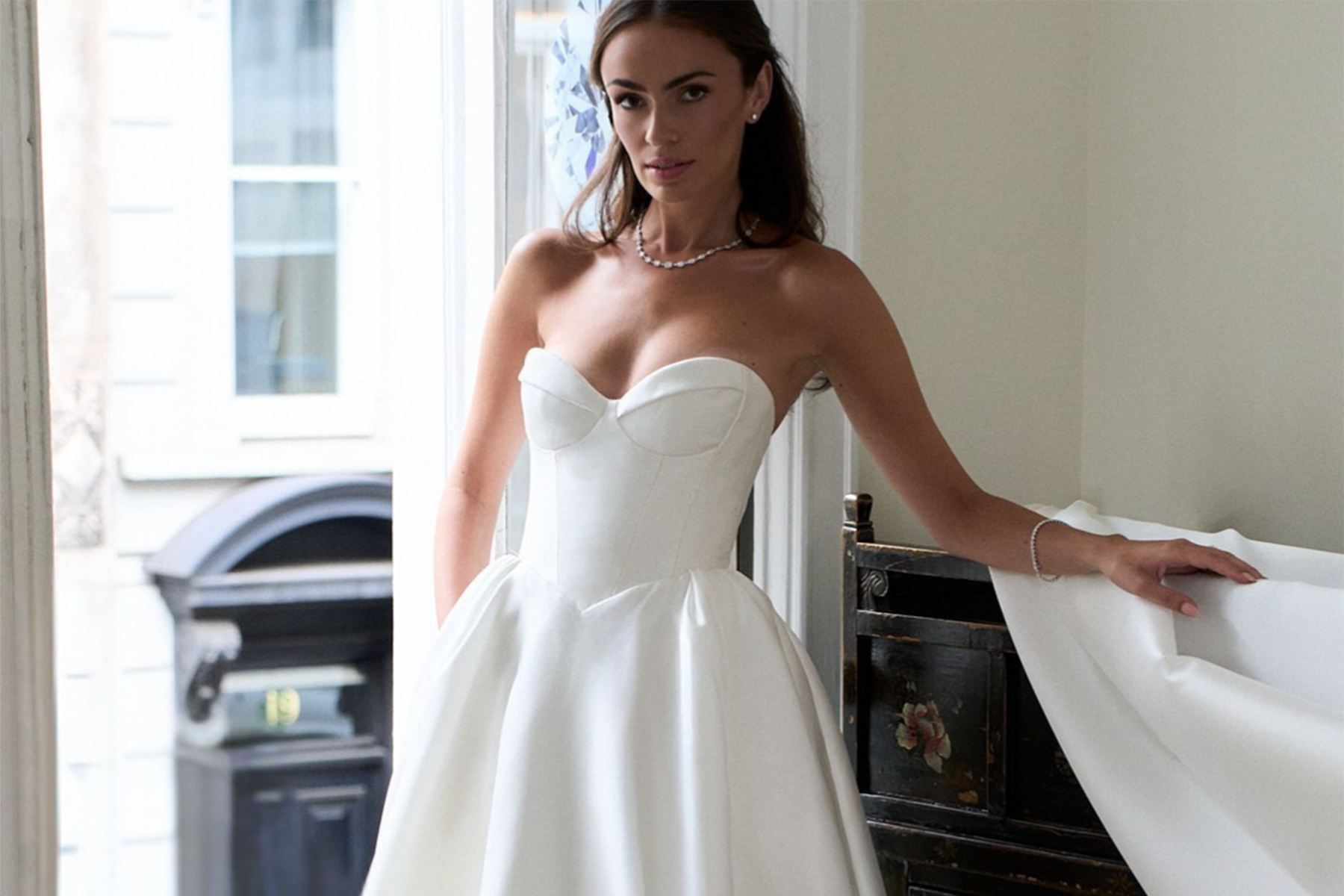 Caroline Castigliano Electric Iris strapless satin wedding gown with a sculpted bodice and full skirt.