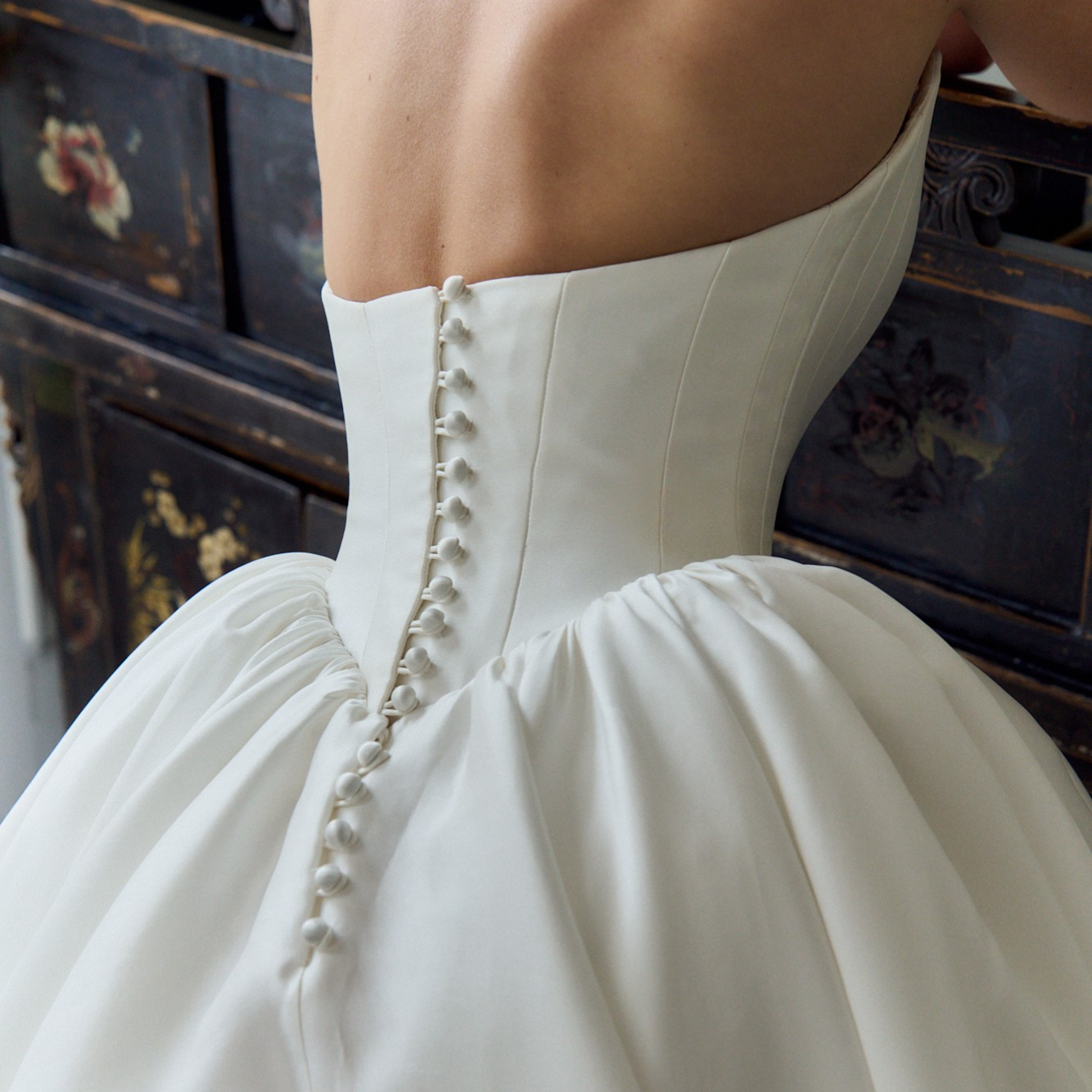 Detail of a Caroline Castigliano wedding gown showcasing signature corsetry and handcrafted construction, available exclusively in New York at Alexia's Bridal.