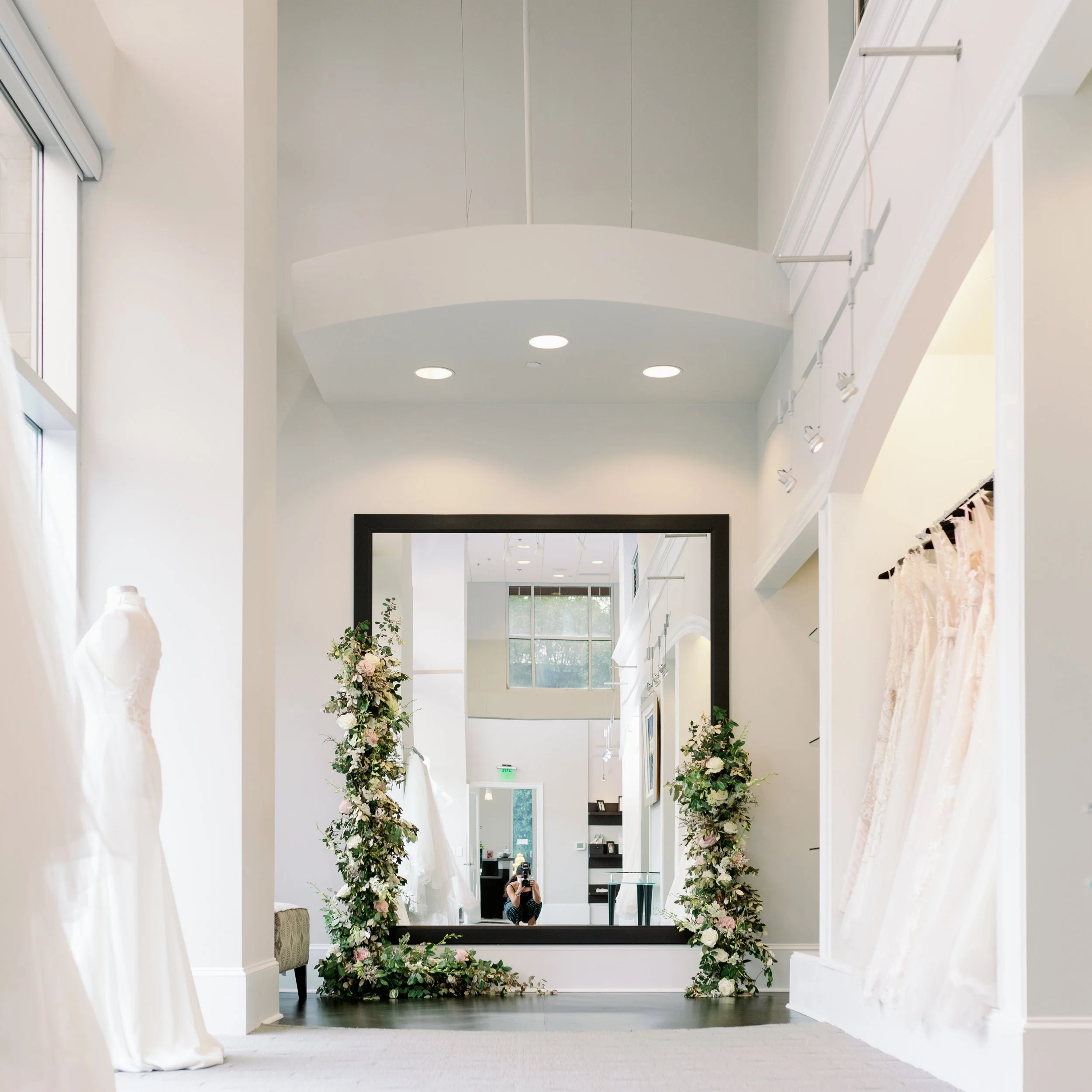Interior of Alexia's flagship bridal boutique in Raleigh featuring an expansive collection of designer wedding gowns.
