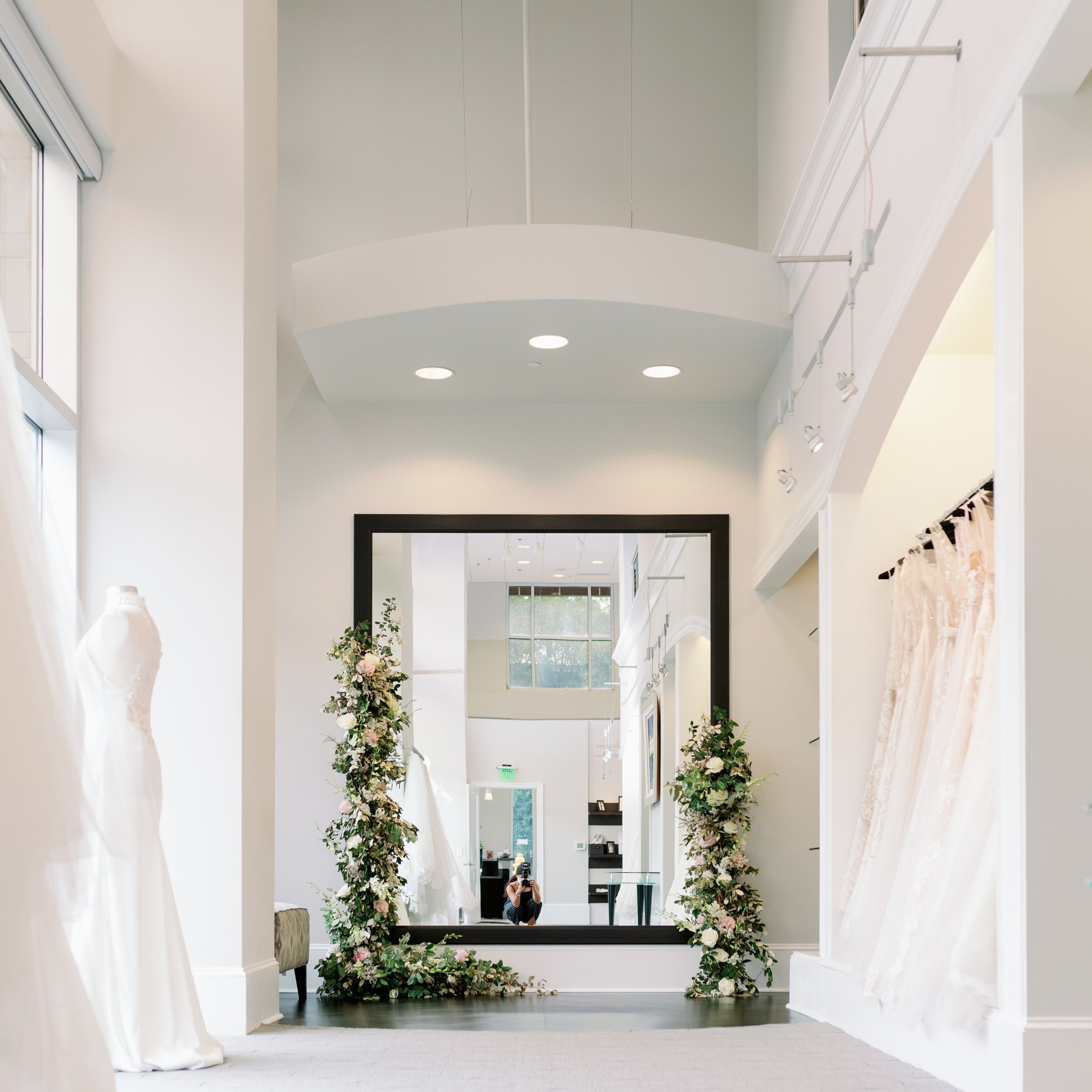 Interior of Alexia's flagship bridal boutique in Raleigh featuring an expansive collection of designer wedding gowns.