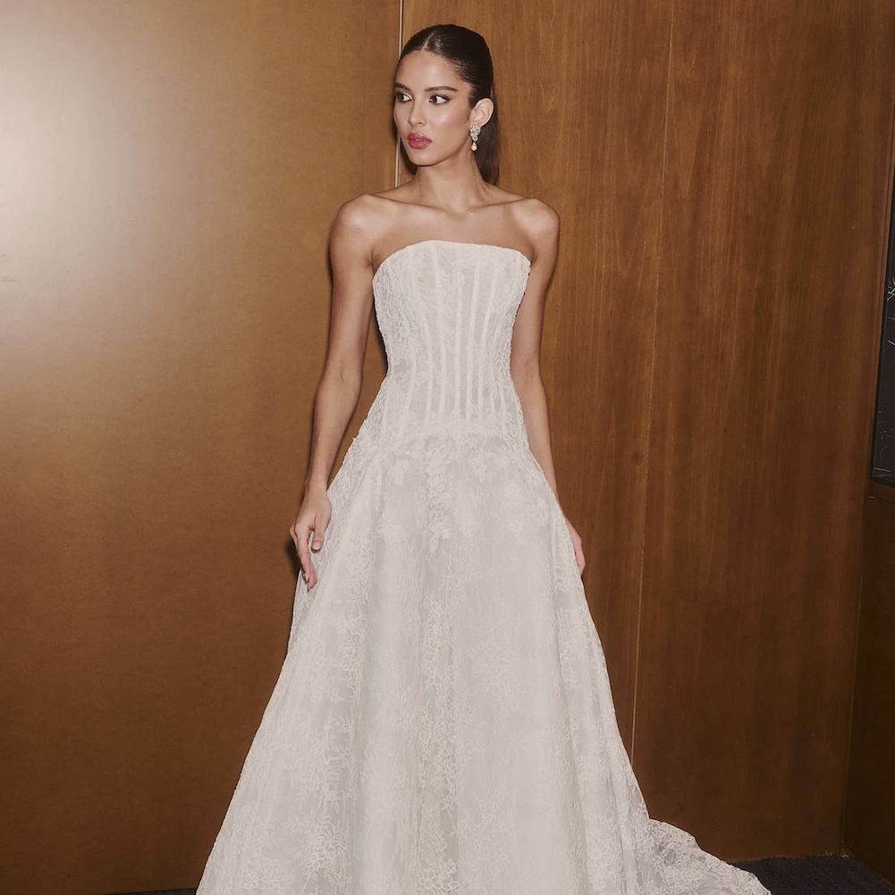 The Romance from the Ines Di Santo V collection featuring a modern wedding dress with contemporary styling and a sculptural silhouette.