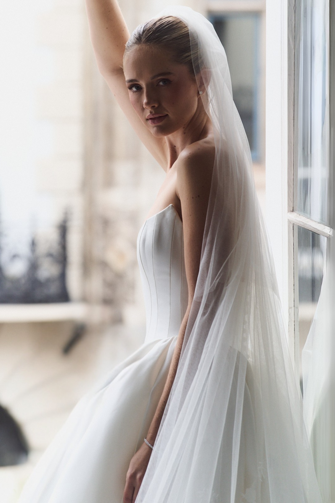 Caroline Castigliano White Peony bridal gown featuring clean architectural lines and luxurious satin.