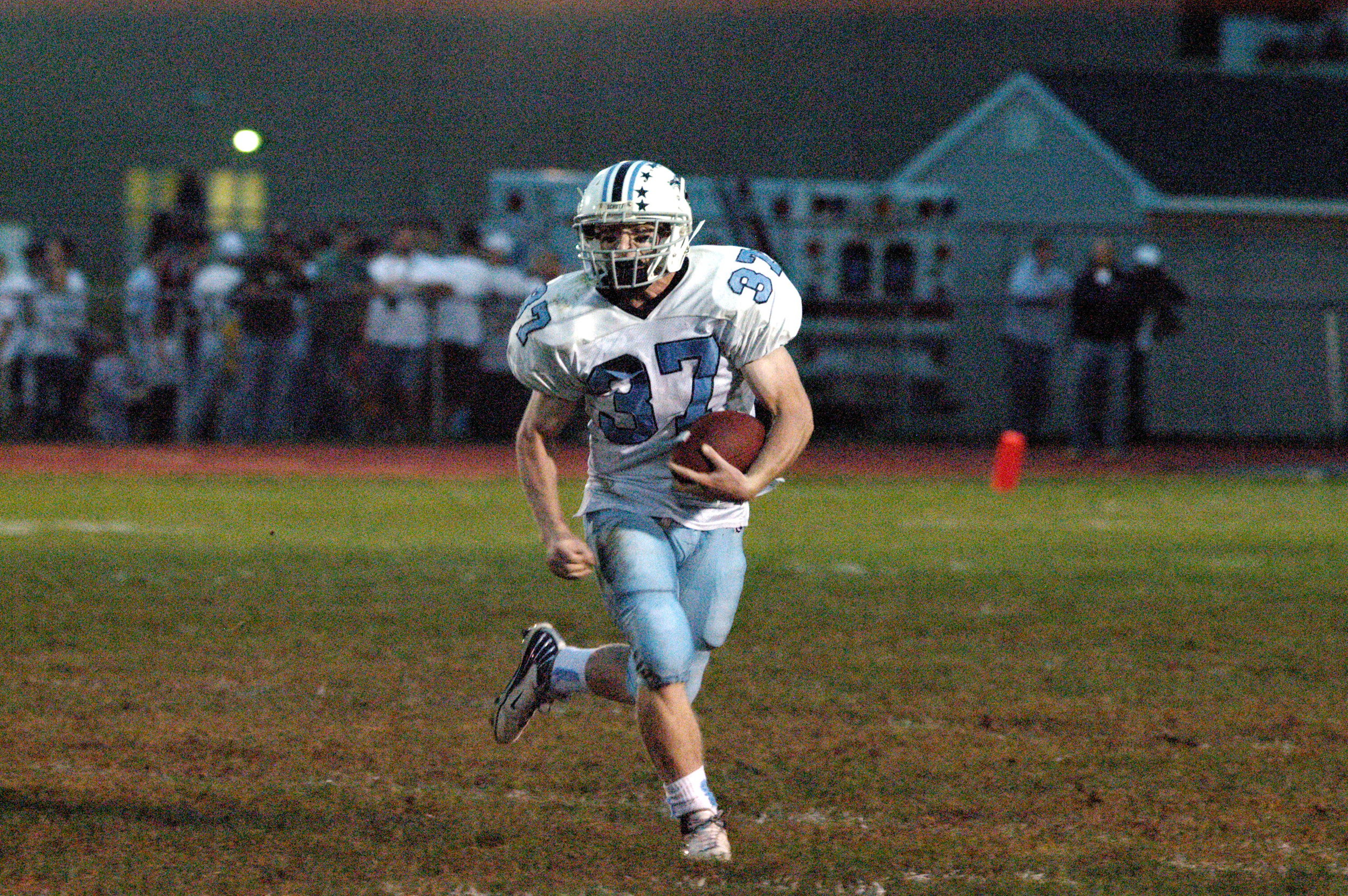 Although this may just look like a normal picture of me running the football on a Friday night in 2007, there is actually a lot more going on. Take a look at my right hand. My clenched fist is in preparation for attempting to run over the Roxbury High School outside linebacker. I succeeded, but at a cost. I separated my shoulder on this play, which led to hurting my opposite shoulder and then using my head as a weapon. I truely believe if I sat out for this shoulder injury, I never would have injured my brain to the extent I did.
