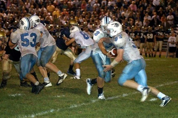 Tyler handing the ball off to me in a game against Roxbury High School.
