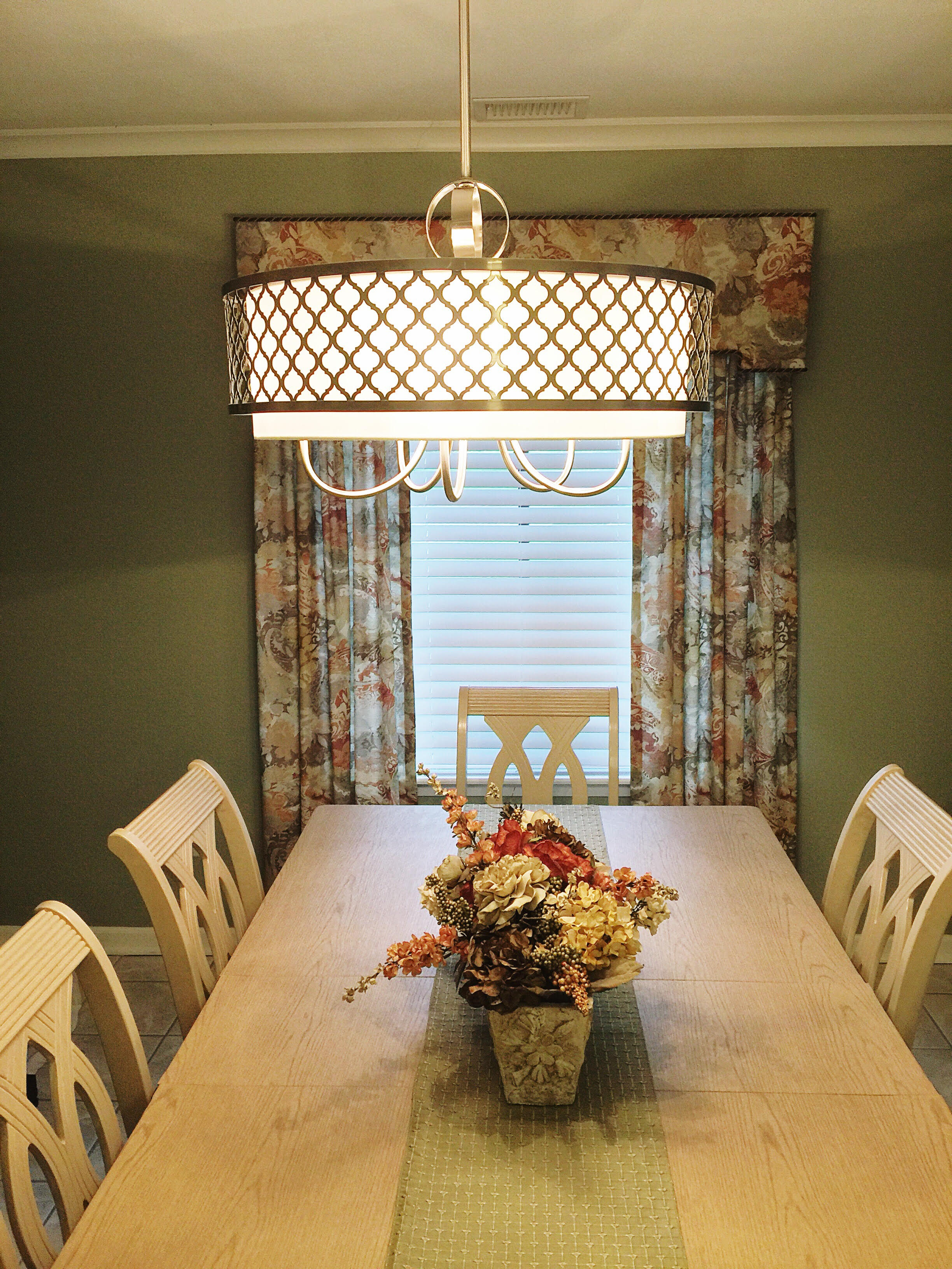   Added new table top, lighting, floral arrangement &amp; wall accessories.  