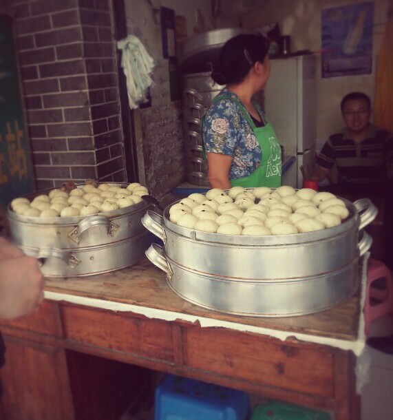 This picture was shot in Chengdu. Chengdu is the capital of Southwestern China's Sicuan province. We loved Chengdu for obvious reasons- the city is famous for its spicy Sicuan cuisine. (I will go into their famous hot pot later). This little stall was tucked away on a street directly behind where we were staying. Two steamed buns cost RMB 1 (20 cents in Can. dollar) A real bargain and absolutely delicious. We would buy half a dozen each morning and sample as we dreamily explored the streets of Chengdu. There was a wide variety each day ranging from vegetables and different types of meat. The steamed minced pork bun was a definite favourite.