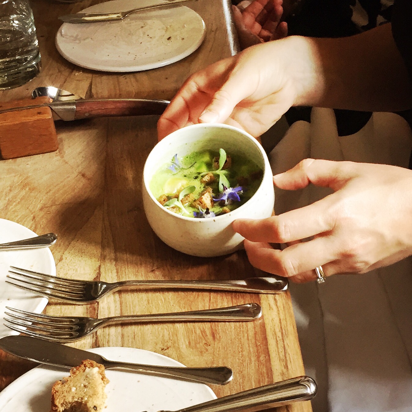 Lovage soup with smoked eel, bramley apple, ham and cheese tortellini