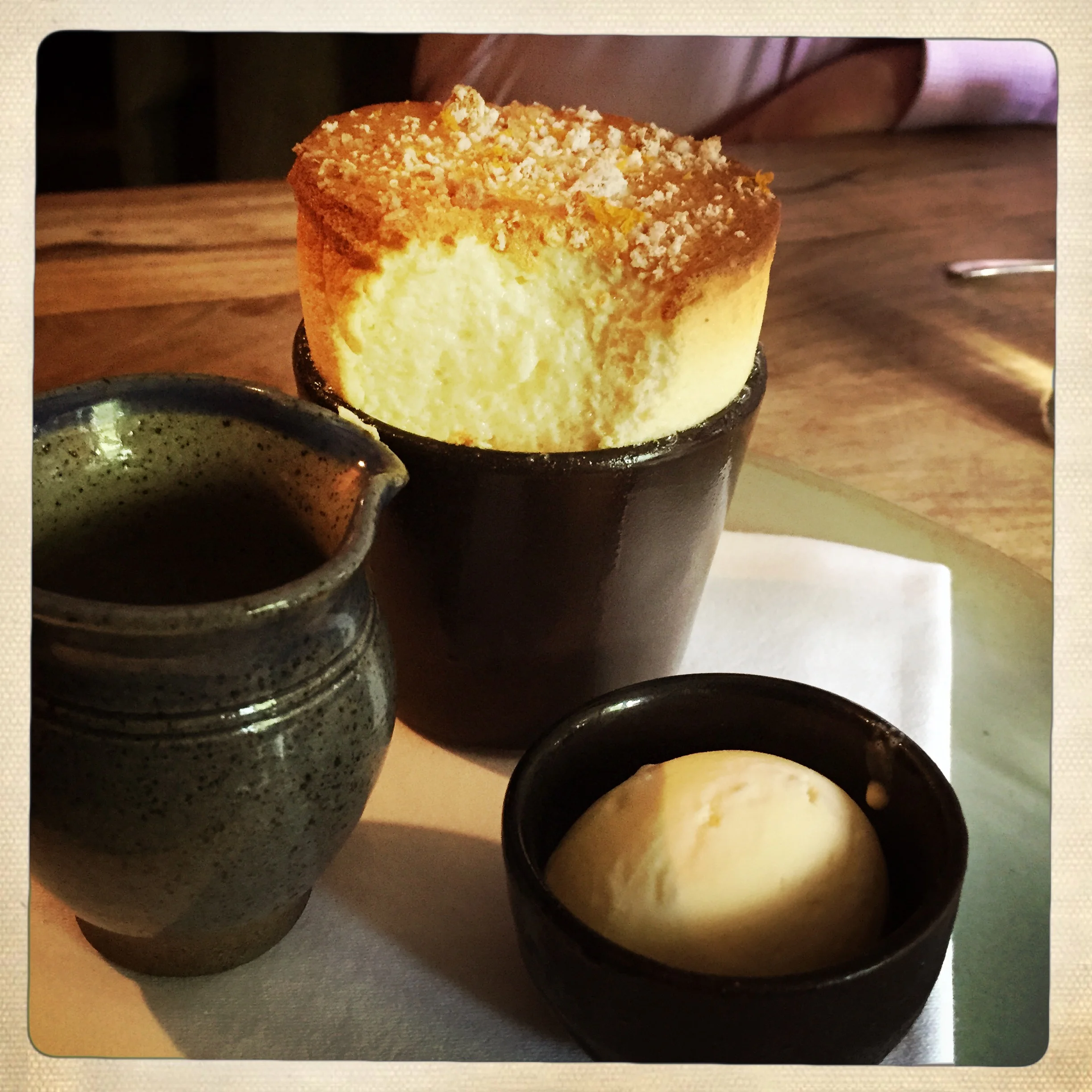 Bitter orange soufflé with sweet toast crumb, cardamom ice cream and citrus syrup