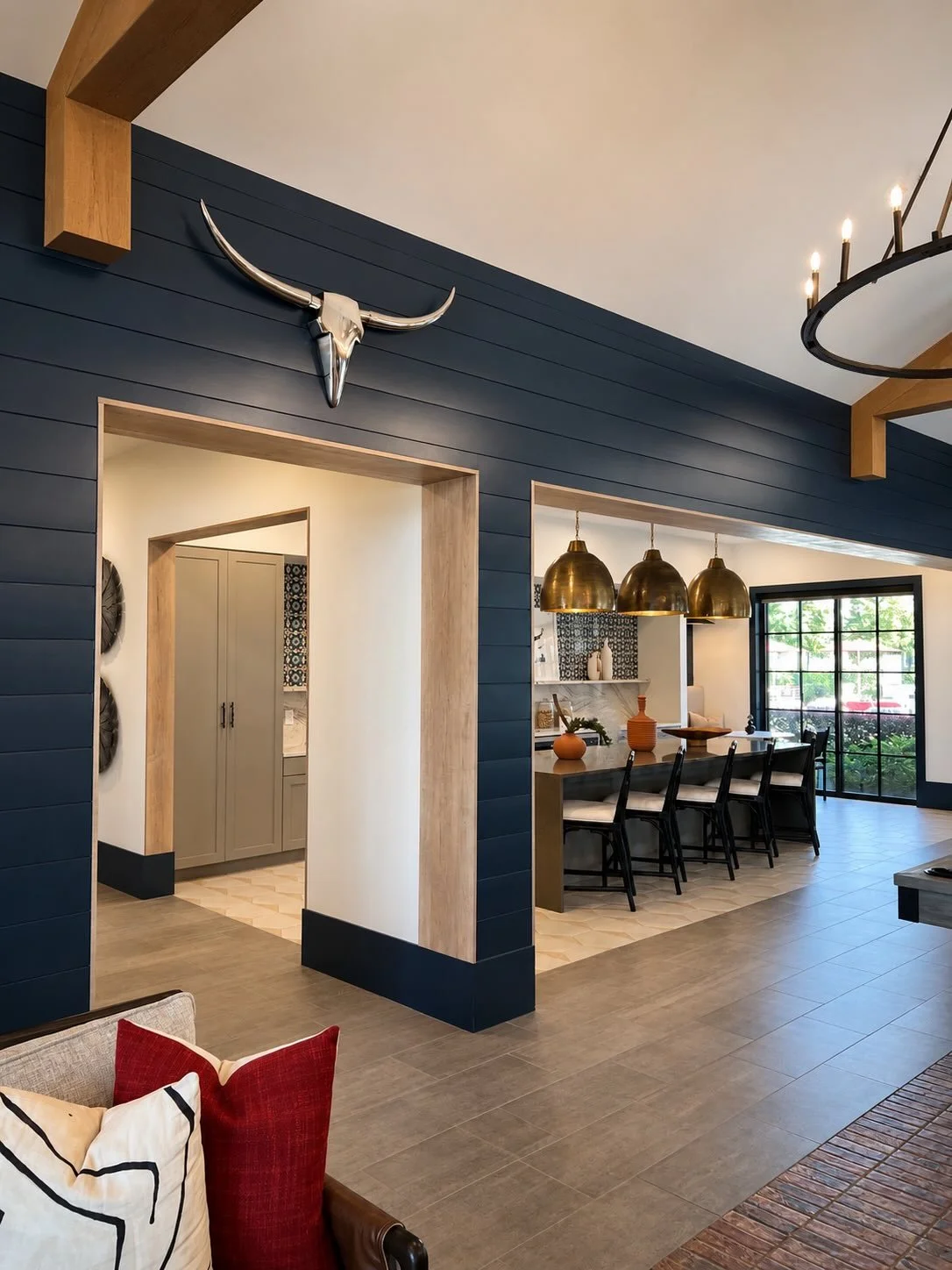 We needed to show you the details of this clubhouse kitchen ✨

The deep blue tones, the way the patterned tile on the floor and backsplash feel bold while still cohesive, the oversized brass statement lighting, and the little nook moment that adds so