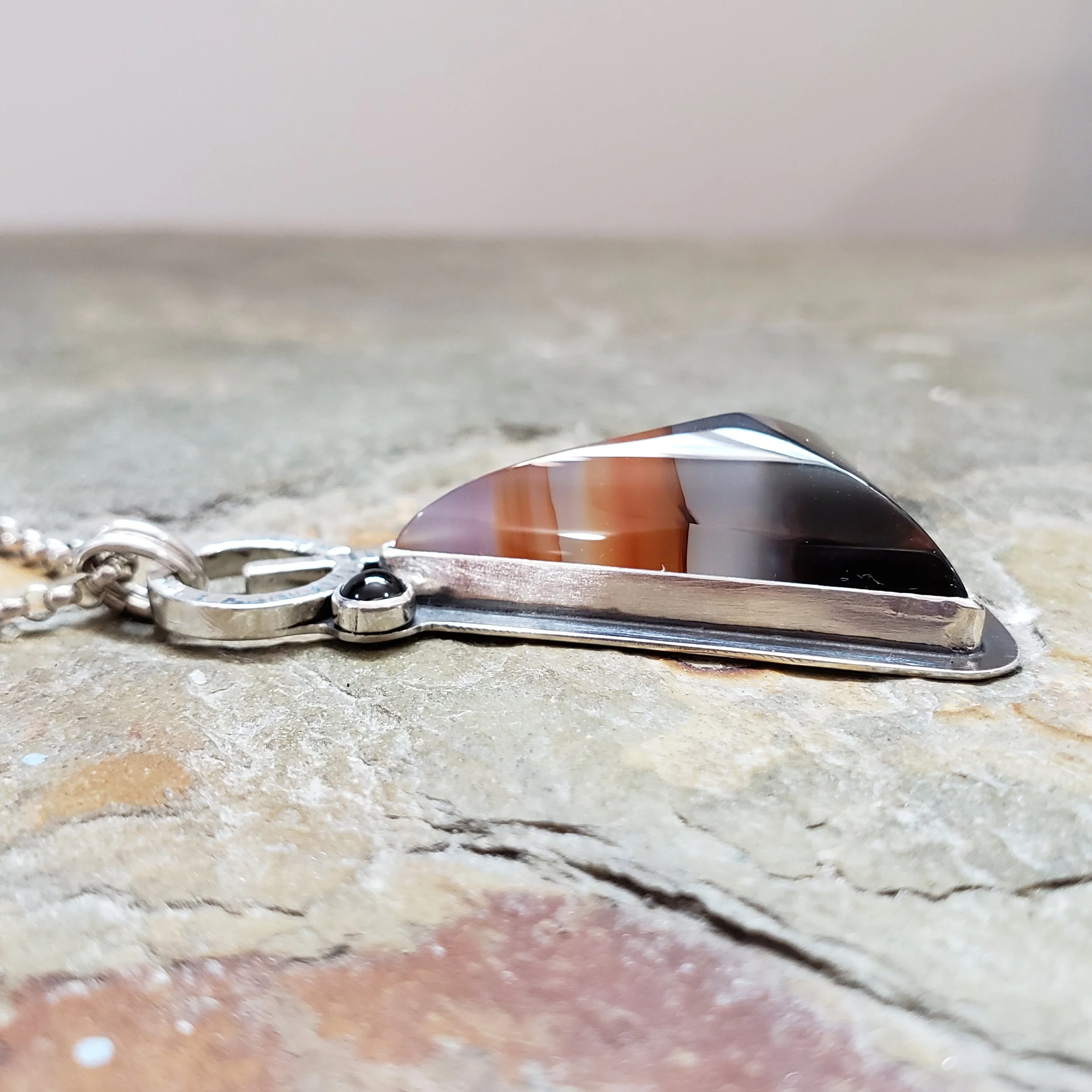 orange black chalcedony and black spinel side.jpg