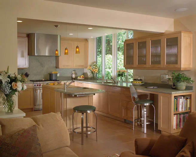 The large window and natural maple cabinetry makes this kitchen light and bright.