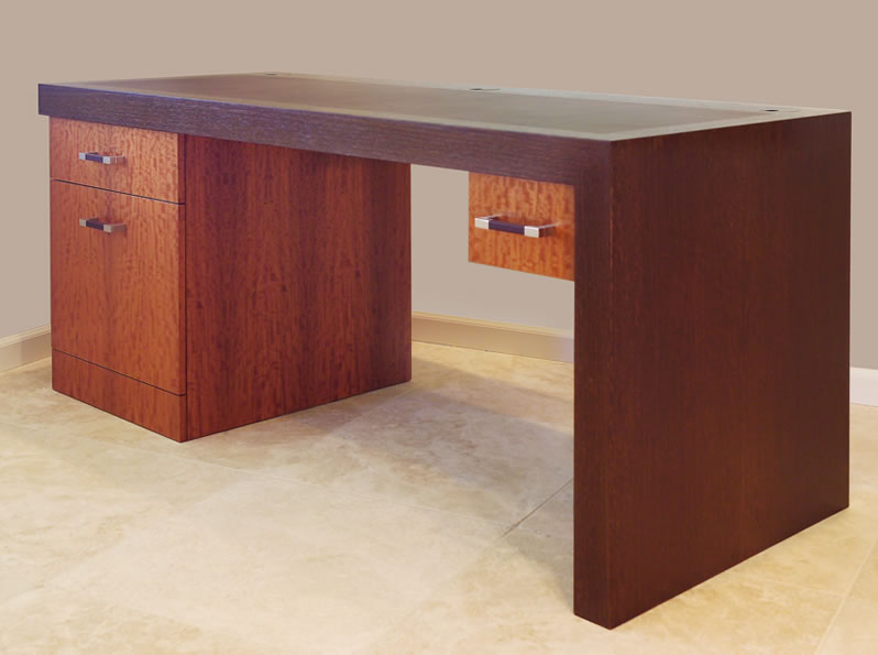 A contemporary desk with leather inlay.