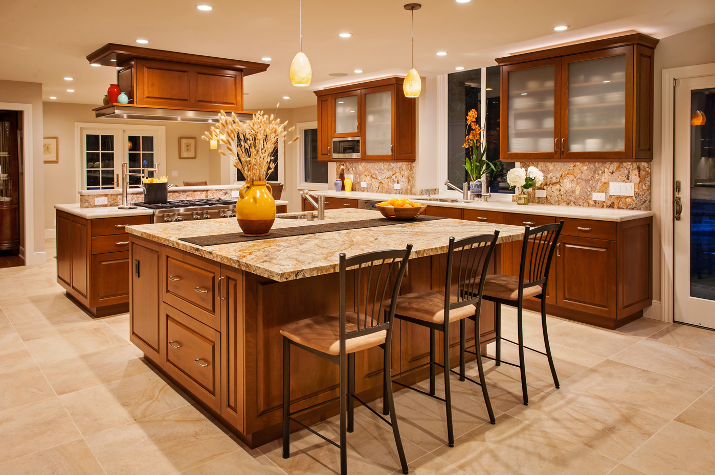 This kitchen has a room for cooks and guests.