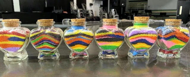 Using different colors of sand, children find a way to express their grief and share something of their special person who died.
