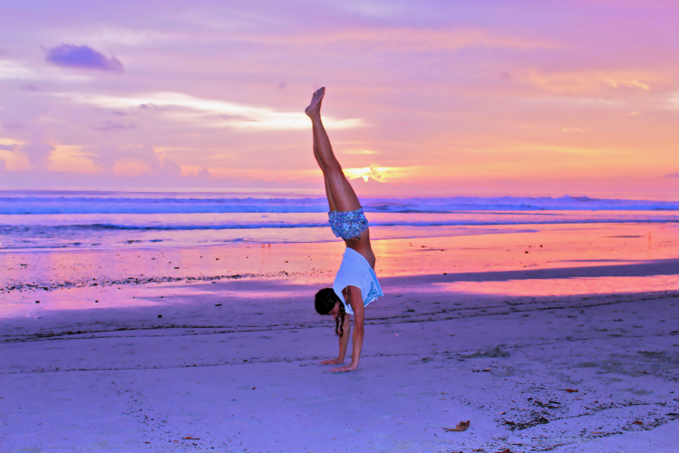 Sometimes I walk on my hands, and most times I walk on my feet, but never both. In yoga, we do Cow Pose on all fours, but this is just a pose in yoga. Photo by Pete Genender in Santa Teresa, Costa Rica.