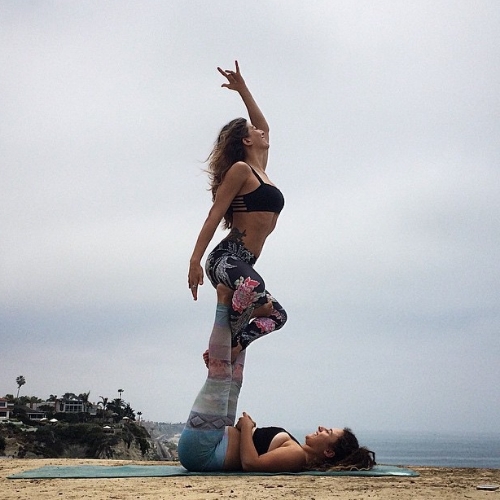 We used my tripod and bluetooth remote to capture this photo. Yogis: @rima_danielle & @yogawithjoelle in San Clemente, California. July 2015.